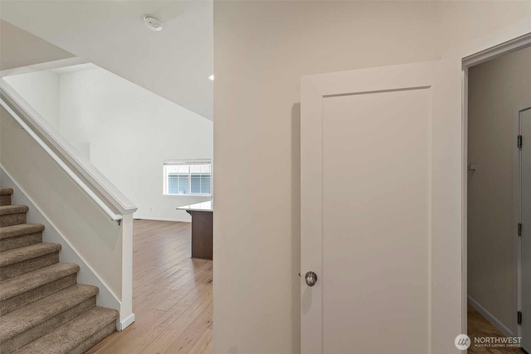 1080 East Old Ranch Road, Unit A1A2 Allyn, WA 98524 - Photo 10 of 35 a view of entryway with wooden floor