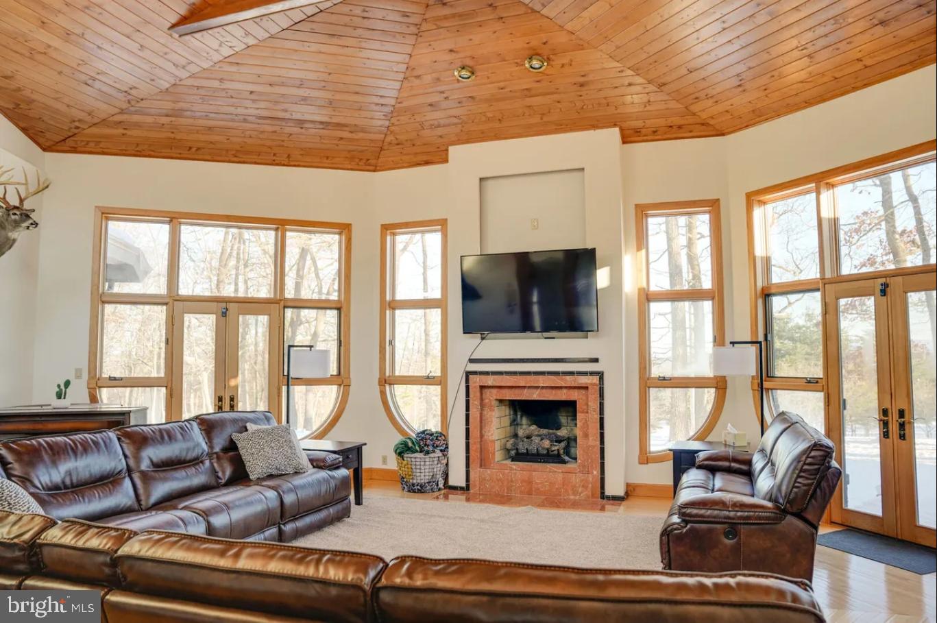 349 Lucas Road Warfordsburg, PA 17267 - Photo 11 of 59 a living room with furniture a flat screen tv and a fireplace