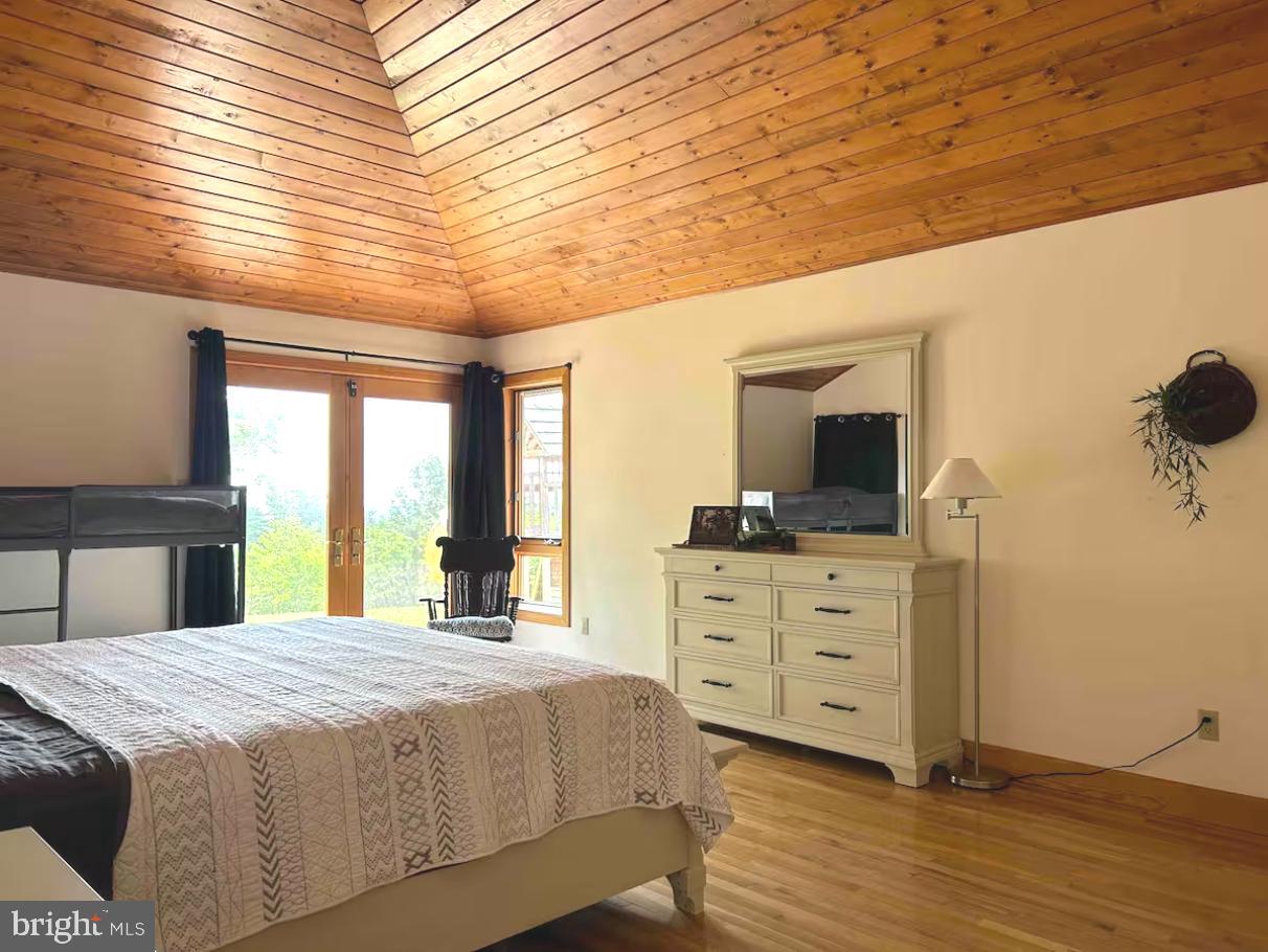 349 Lucas Road Warfordsburg, PA 17267 - Photo 27 of 59 a bedroom with a bed and a flat tv screen