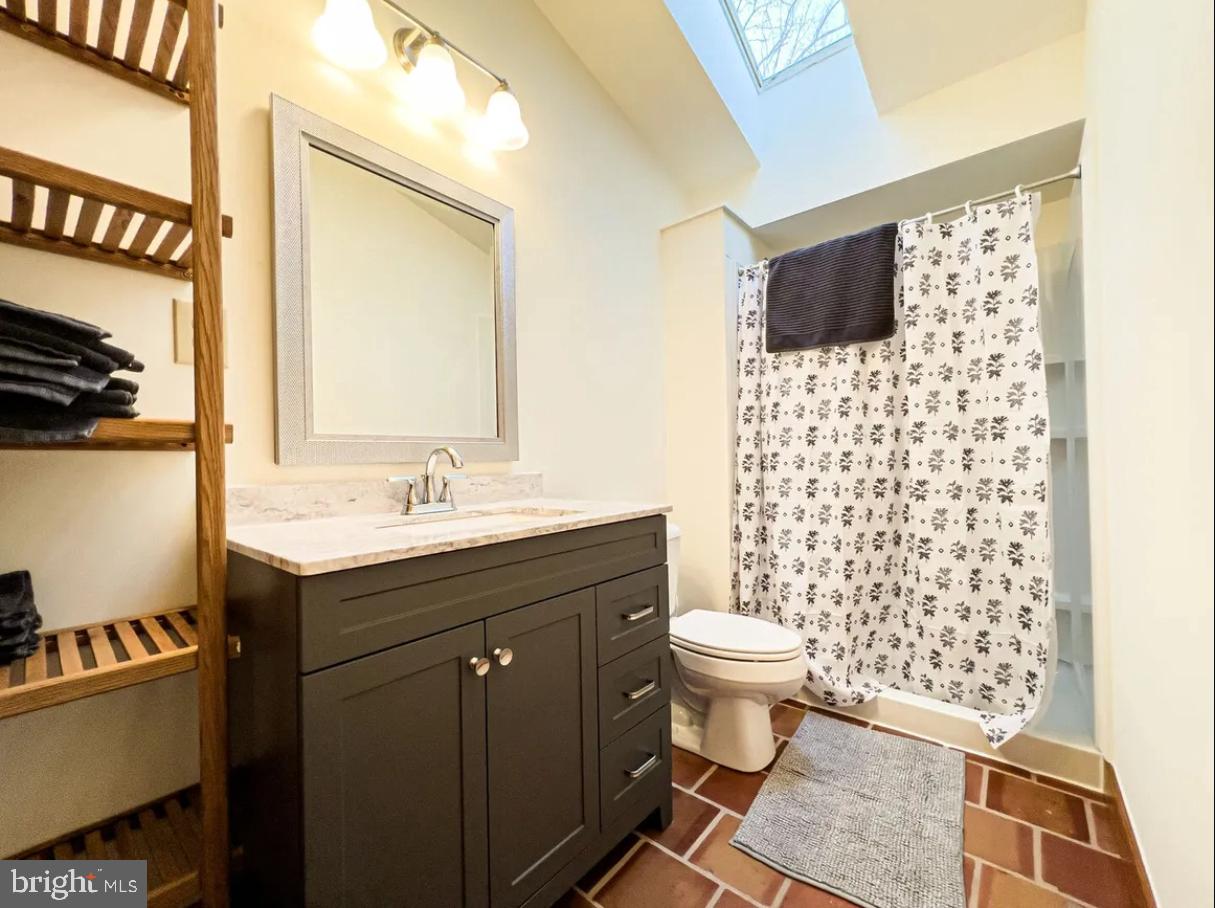 349 Lucas Road Warfordsburg, PA 17267 - Photo 34 of 59 a bathroom with a sink toilet mirror and shower