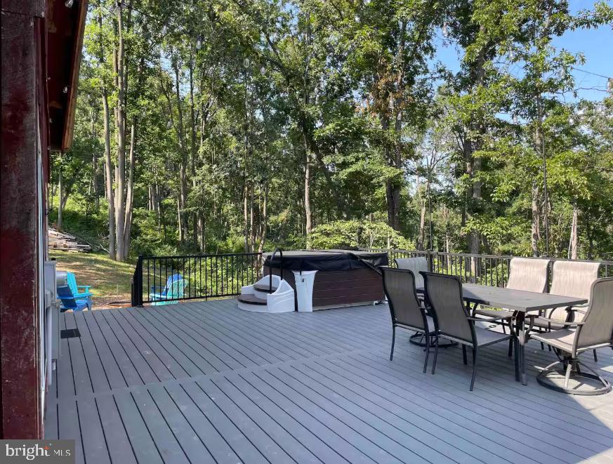349 Lucas Road Warfordsburg, PA 17267 - Photo 43 of 59 a view of a roof deck with table and chairs and wooden floor