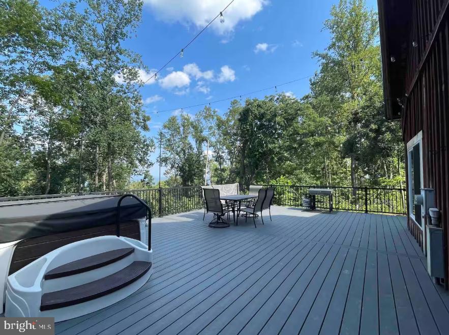 349 Lucas Road Warfordsburg, PA 17267 - Photo 44 of 59 a view of a patio with table and chairs with wooden floor and fence