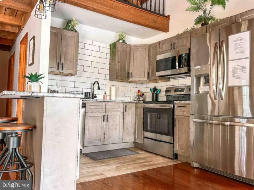 349 Lucas Road Warfordsburg, PA 17267 - Photo 51 of 59 a kitchen with stainless steel appliances granite countertop a refrigerator sink and microwave