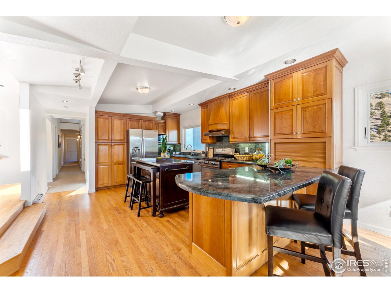 5339 Olde Stage Road Boulder, CO 80302 - Photo 11 of 40 Spacious open-air kitchen layout. Granite counter tops, gas range and self cleaning oven. Kitchen aide appliances.