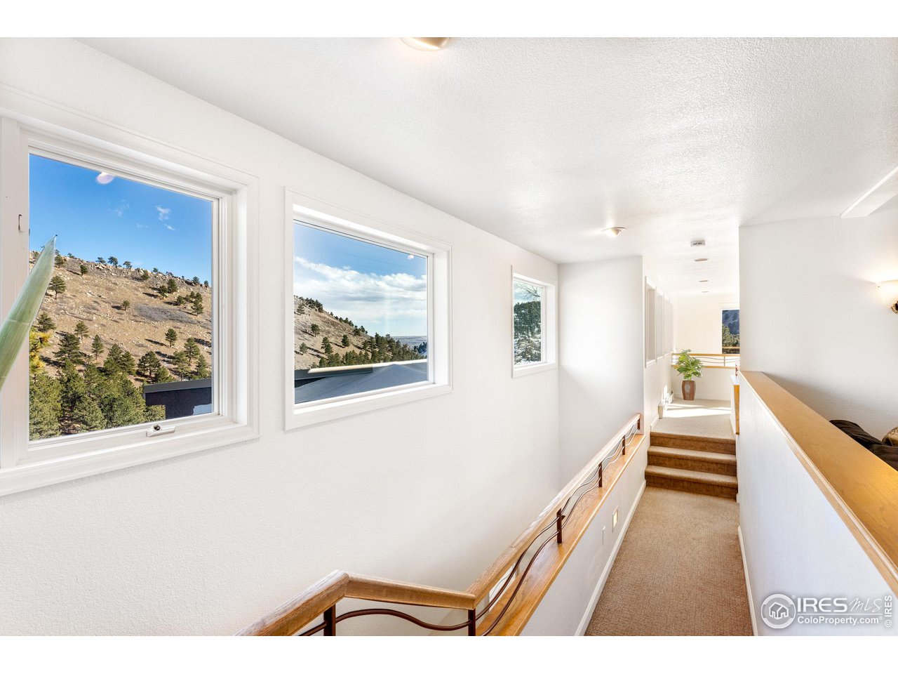 5339 Olde Stage Road Boulder, CO 80302 - Photo 20 of 40 Upper Level breeze way connecting master suites, and pool room to family room and living room.