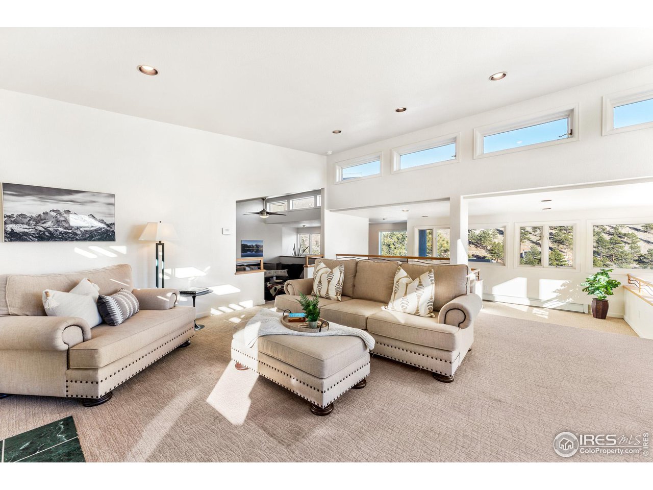 5339 Olde Stage Road Boulder, CO 80302 - Photo 21 of 40 Spacious formal sitting room with gas fireplace, high ceilings and 270 degree mountain valley views.