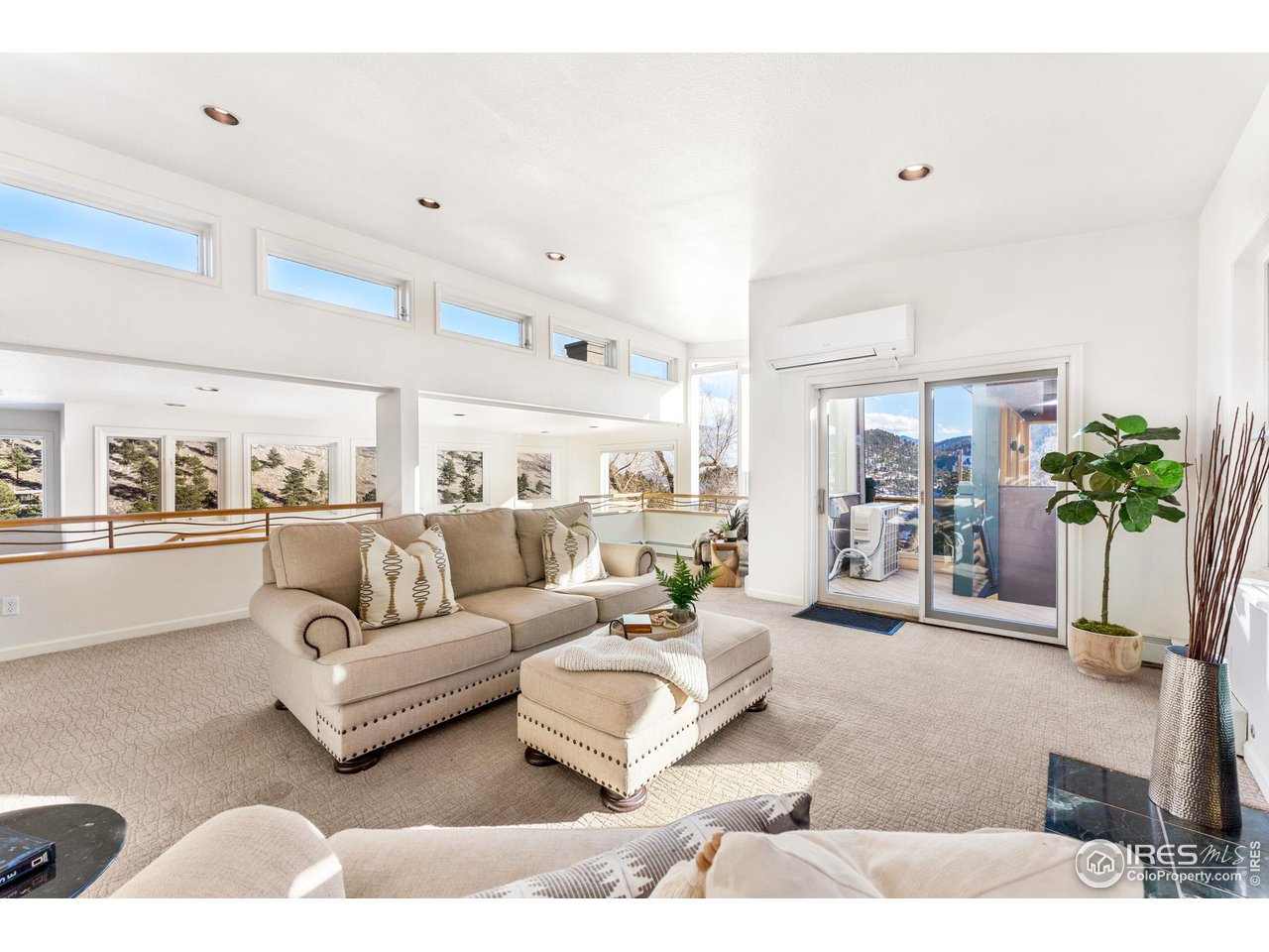 5339 Olde Stage Road Boulder, CO 80302 - Photo 22 of 40 Spacious formal sitting room with gas fireplace, high ceilings and 270 degree mountain valley views.