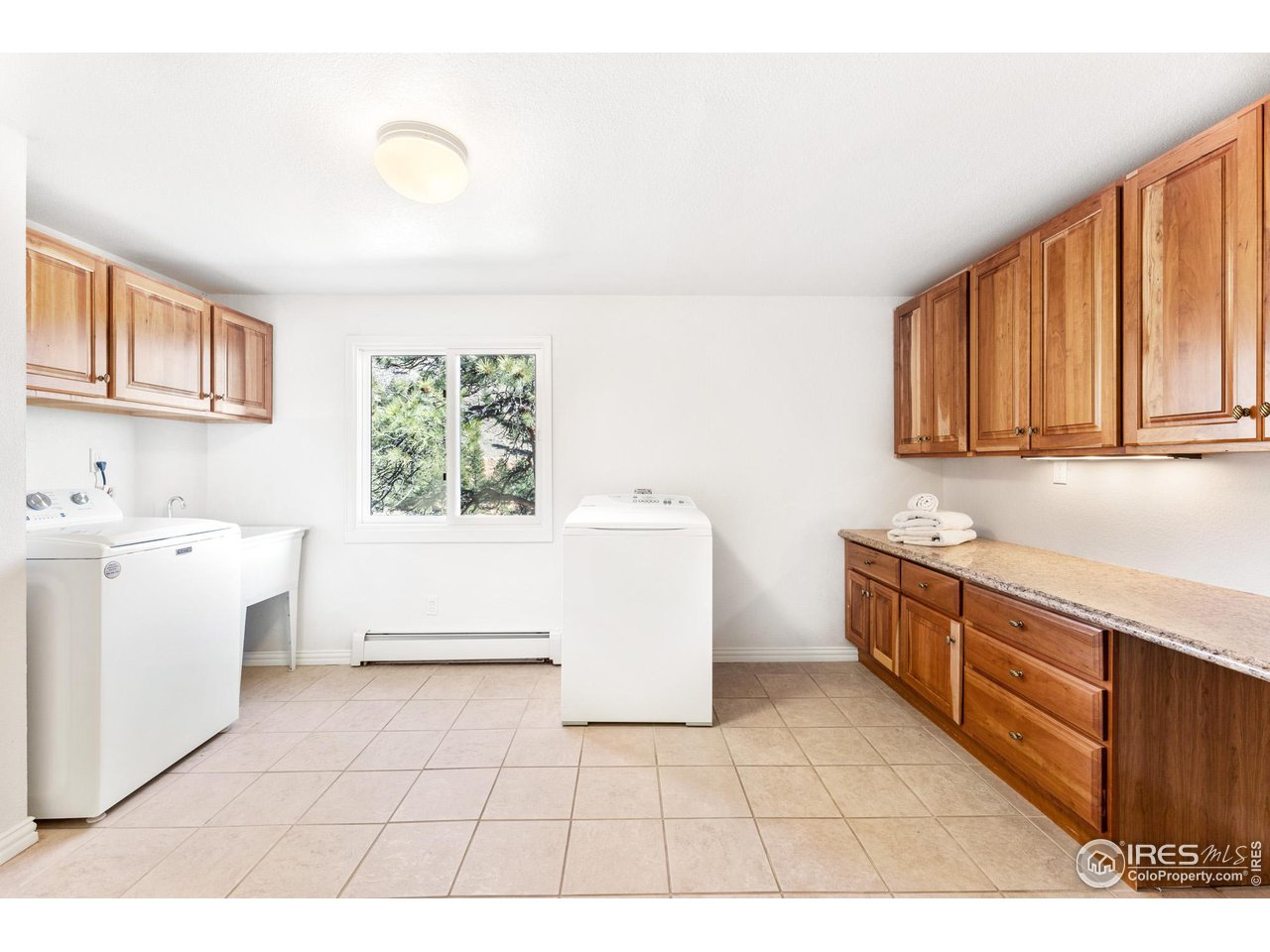 5339 Olde Stage Road Boulder, CO 80302 - Photo 33 of 40 Generous Laundry Room with plenty of storage and Fischer Paykel Washer Dryer