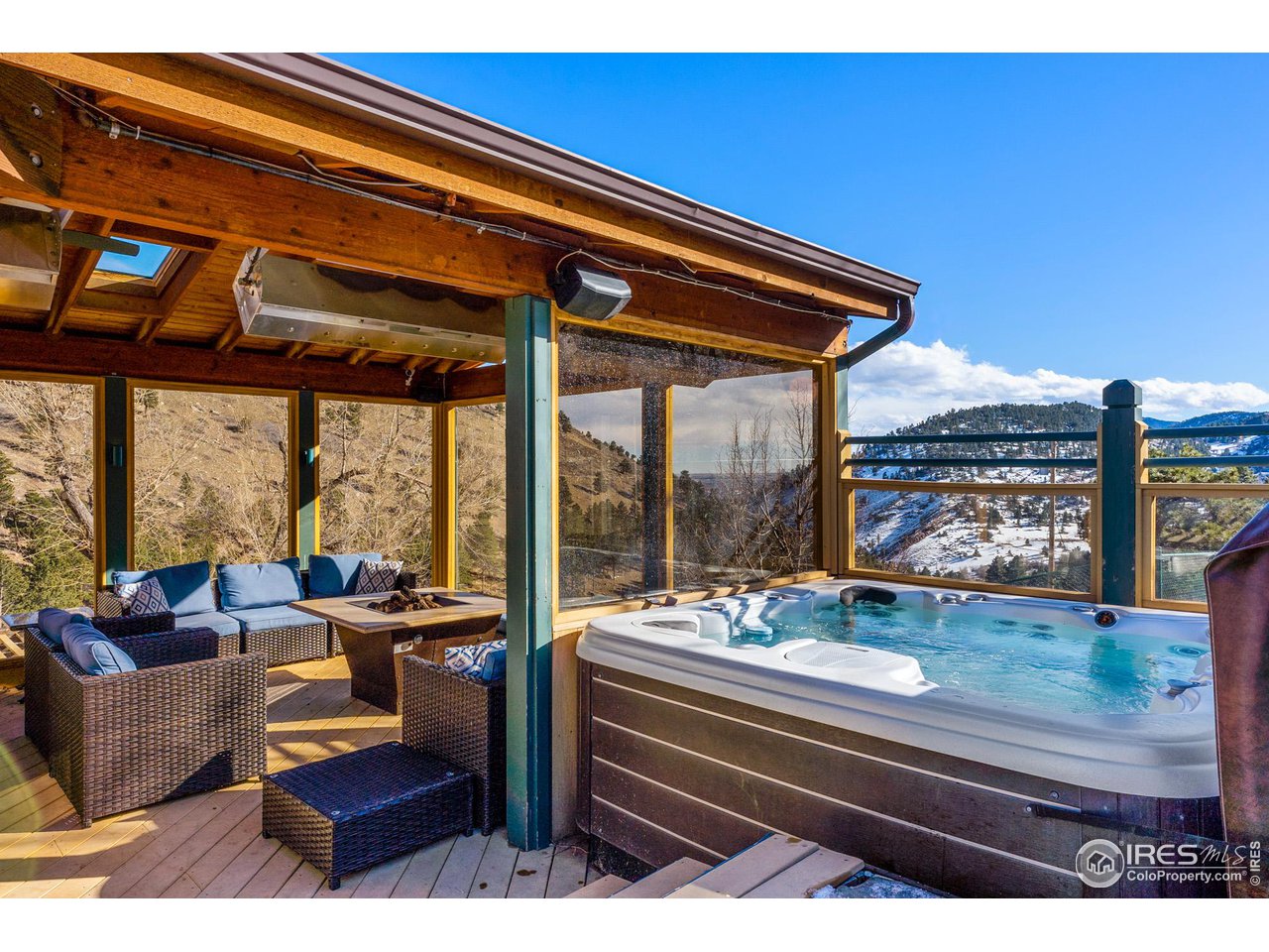 5339 Olde Stage Road Boulder, CO 80302 - Photo 35 of 40 Outdoor living at it's best... Hot Tub, Outdoor kitchen, refrigerator, commercially heated enclosed sitting area, shaded portico with gas fireplace.