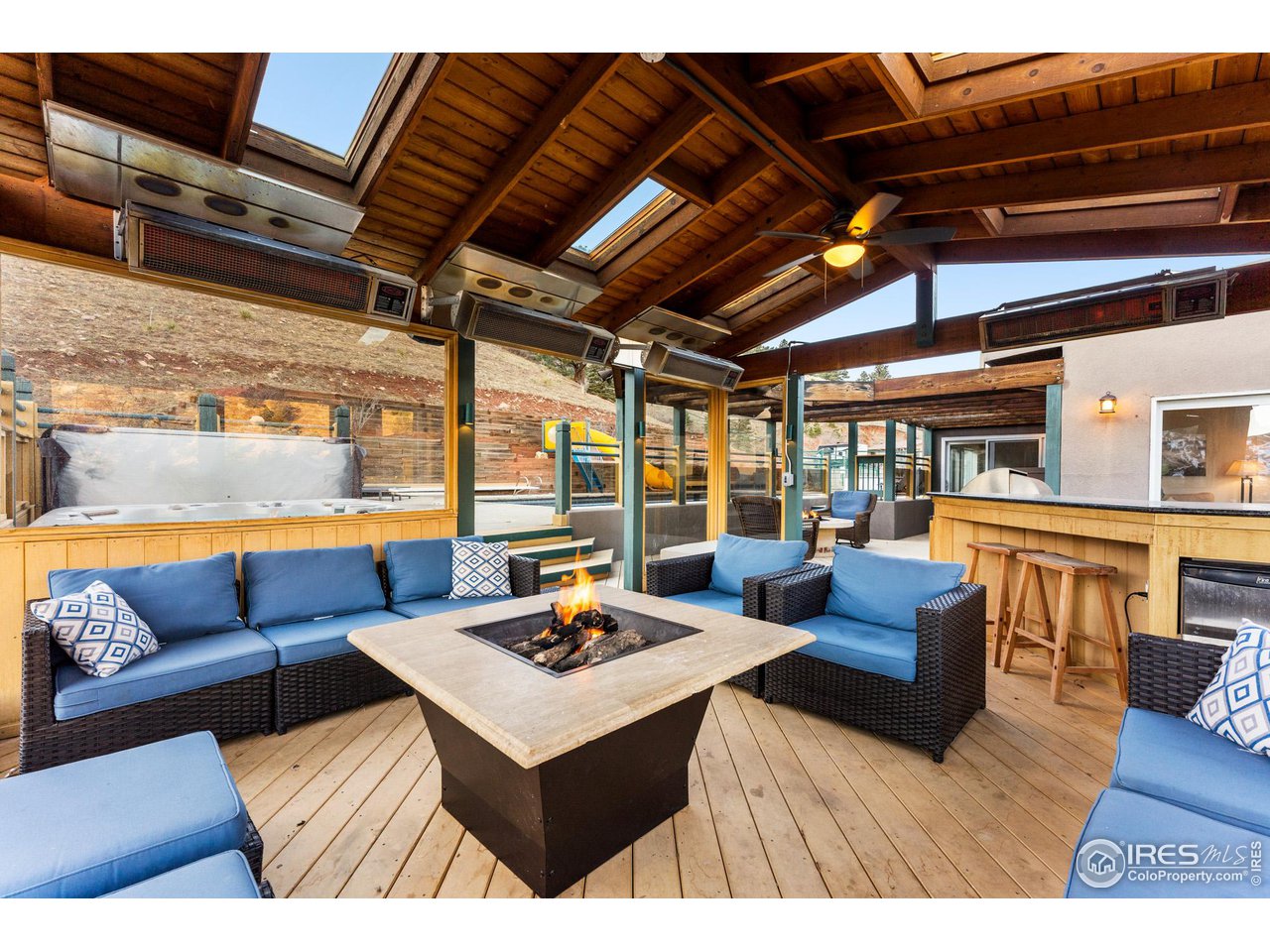 5339 Olde Stage Road Boulder, CO 80302 - Photo 36 of 40 Outdoor living at it's best... Hot Tub, Outdoor kitchen, refrigerator, commercially heated enclosed sitting area, shaded portico with gas fireplace.