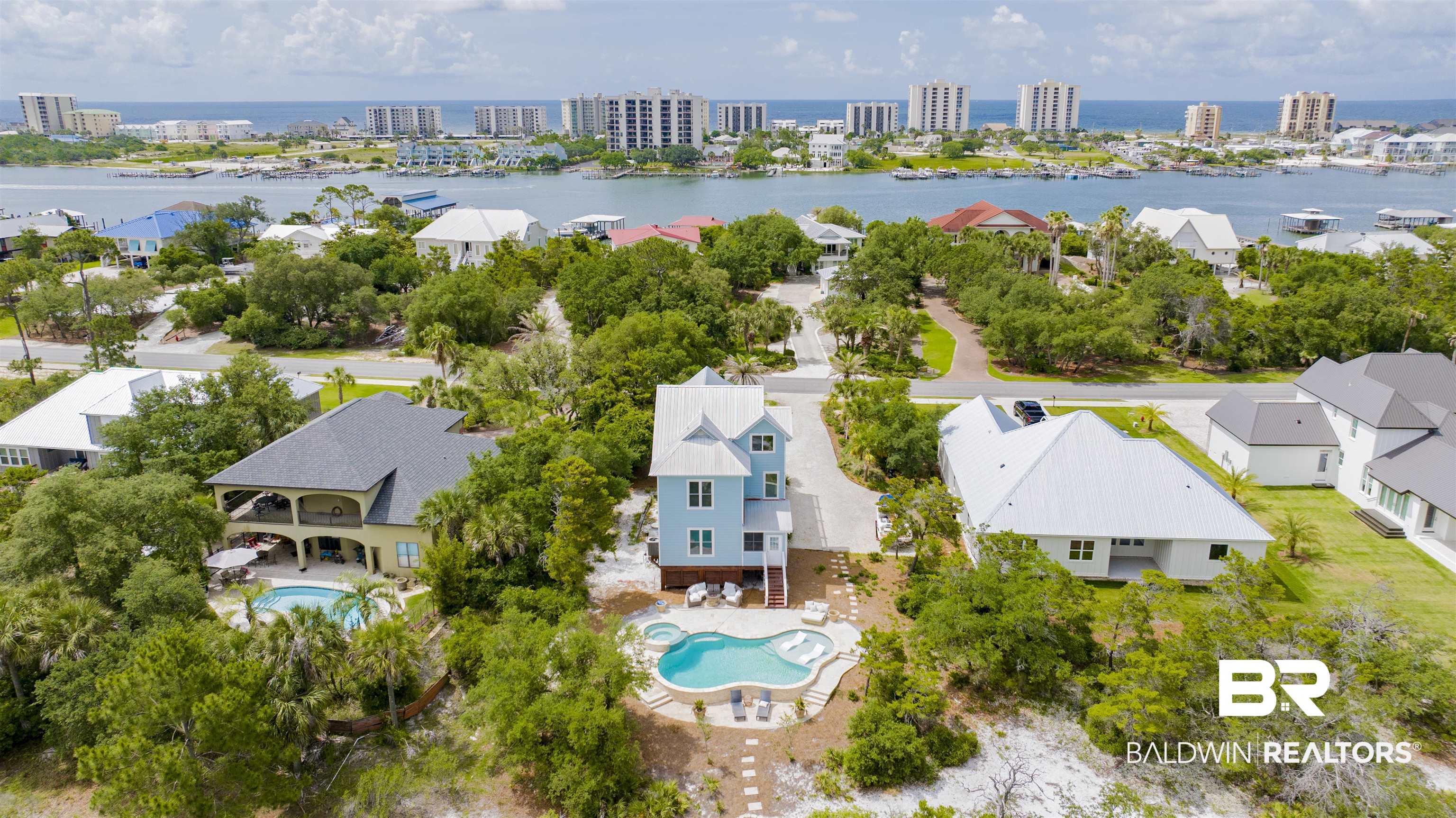 30351 River Road Orange Beach, AL 36561 - Photo 41 of 44 Three-story coastal-style residence featuring a private pool with an integrated spa