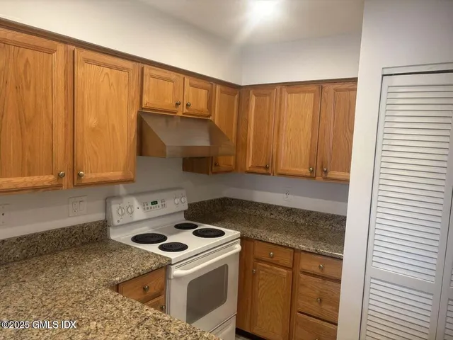 a kitchen with a stove and a sink