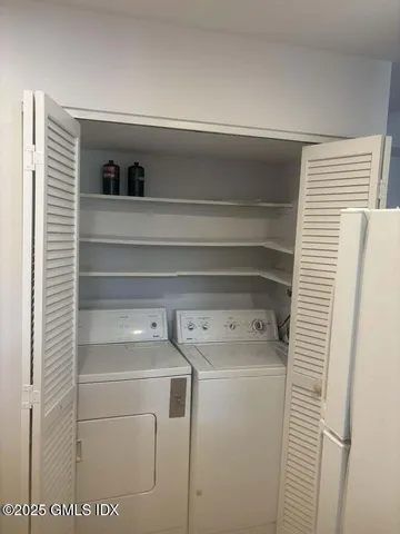 a utility room with washer and dryer