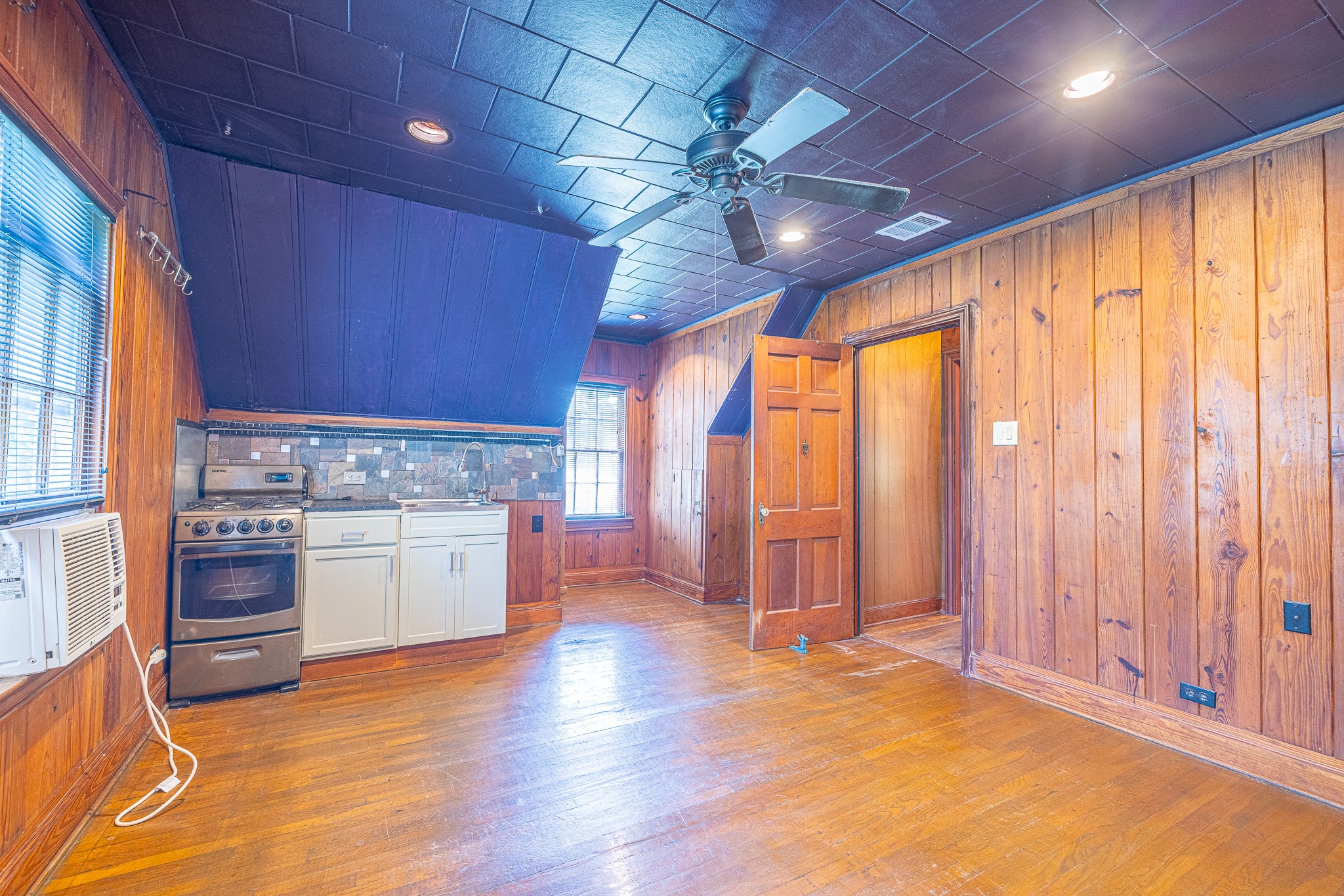 8548 Findlay Street Houston, TX 77017 - Photo 32 of 50 a view of an empty room with a window and wooden floor