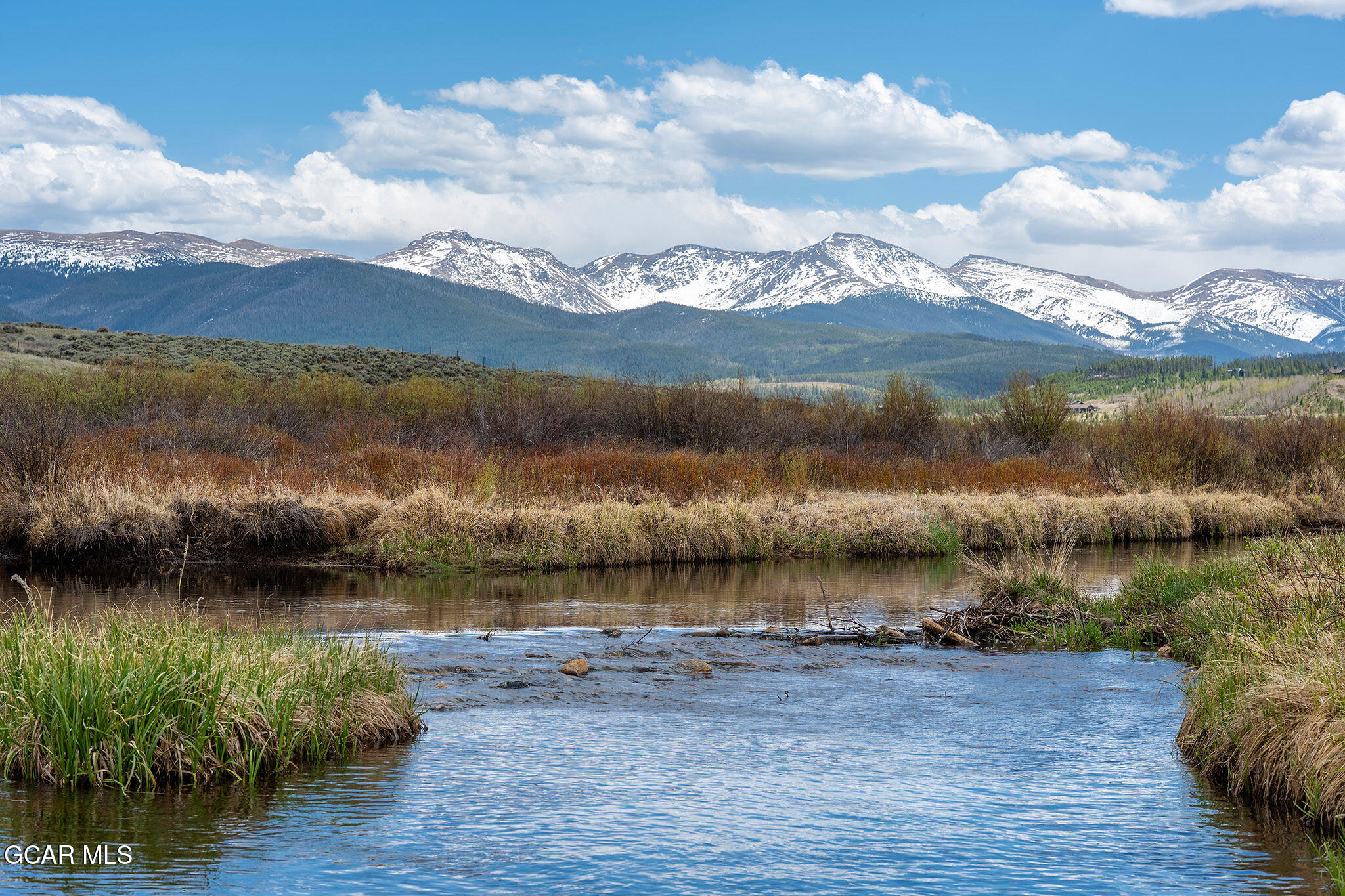732 Gcr 8311/ Clayton Ranch Road Tabernash, CO 80478 - Photo 26 of 65 a view of a lake with houses in the back