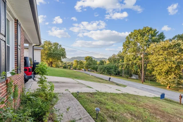 a view of a pathway with a yard