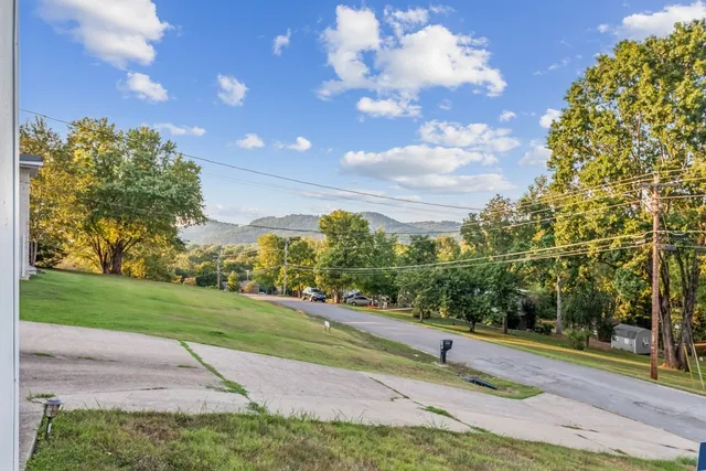 a view of a road with a yard