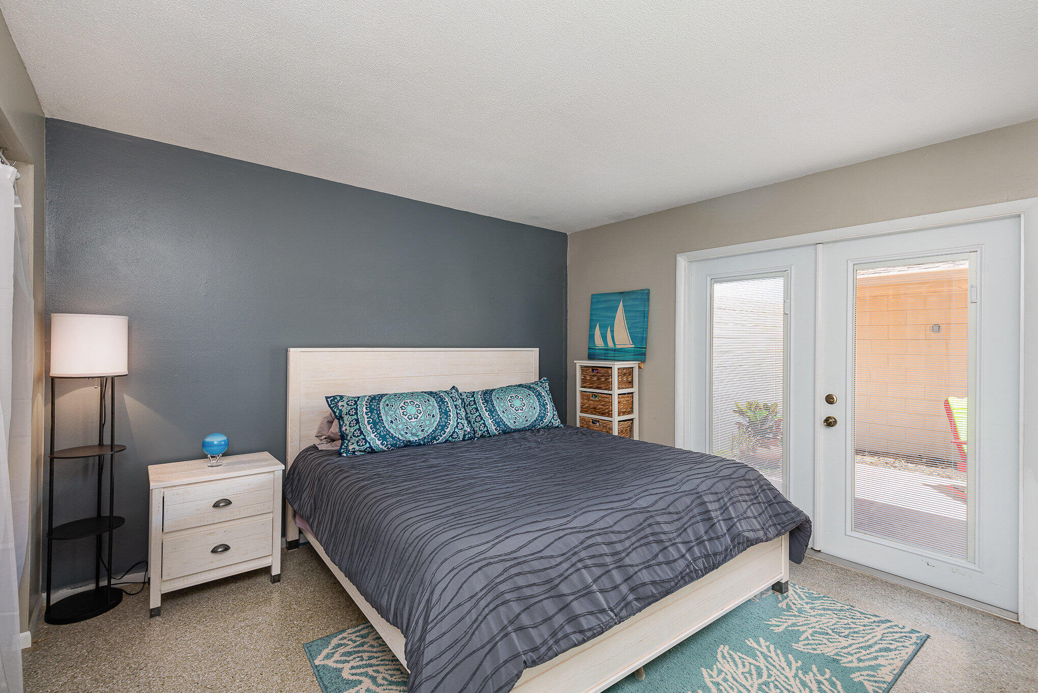 941 Levitt Parkway Rockledge, FL 32955 - Photo 12 of 33 a bedroom with a bed and a lamp