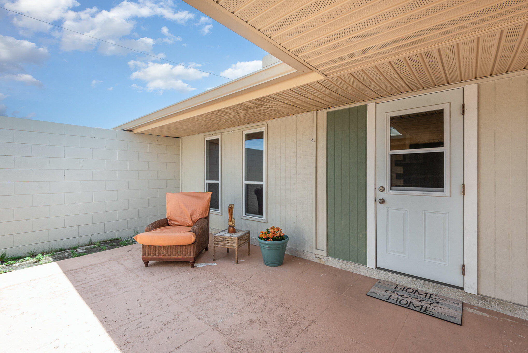 941 Levitt Parkway Rockledge, FL 32955 - Photo 22 of 33 a view of a patio with couple of chairs in front of door