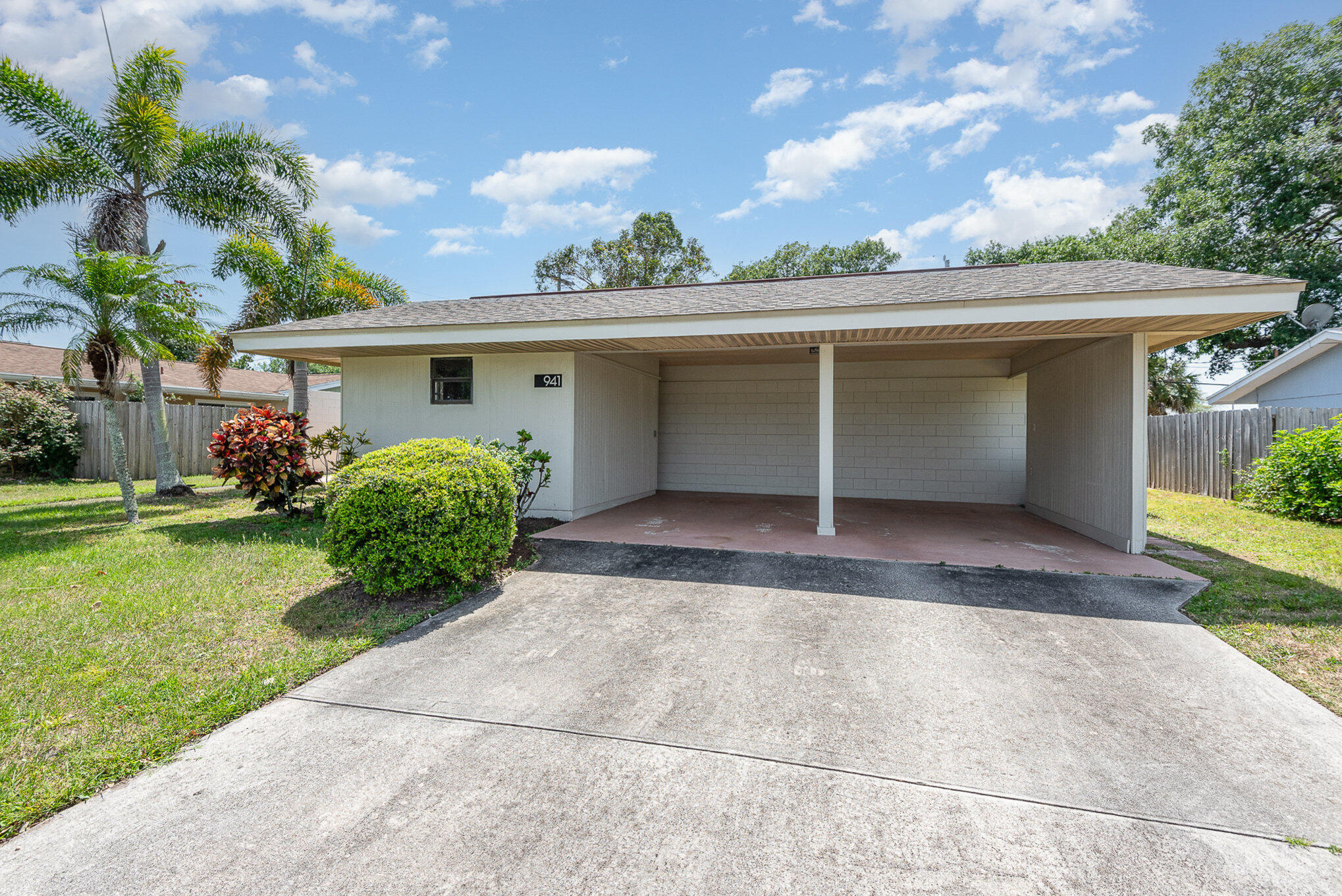 941 Levitt Parkway Rockledge, FL 32955 - Photo 24 of 33 a view of a house with a backyard