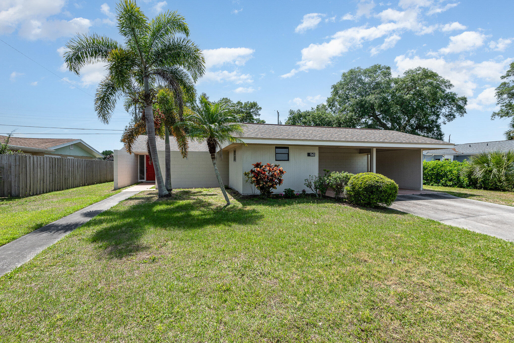 941 Levitt Parkway Rockledge, FL 32955 - Photo 25 of 33 a front view of house with yard and green space