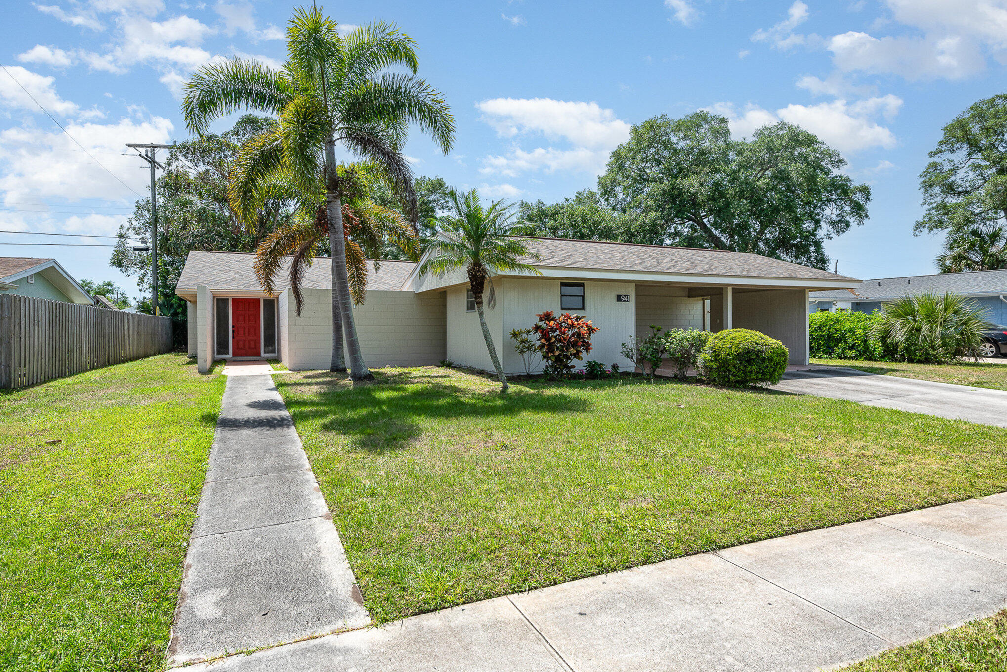 941 Levitt Parkway Rockledge, FL 32955 - Photo 26 of 33 a front view of house with yard and green space
