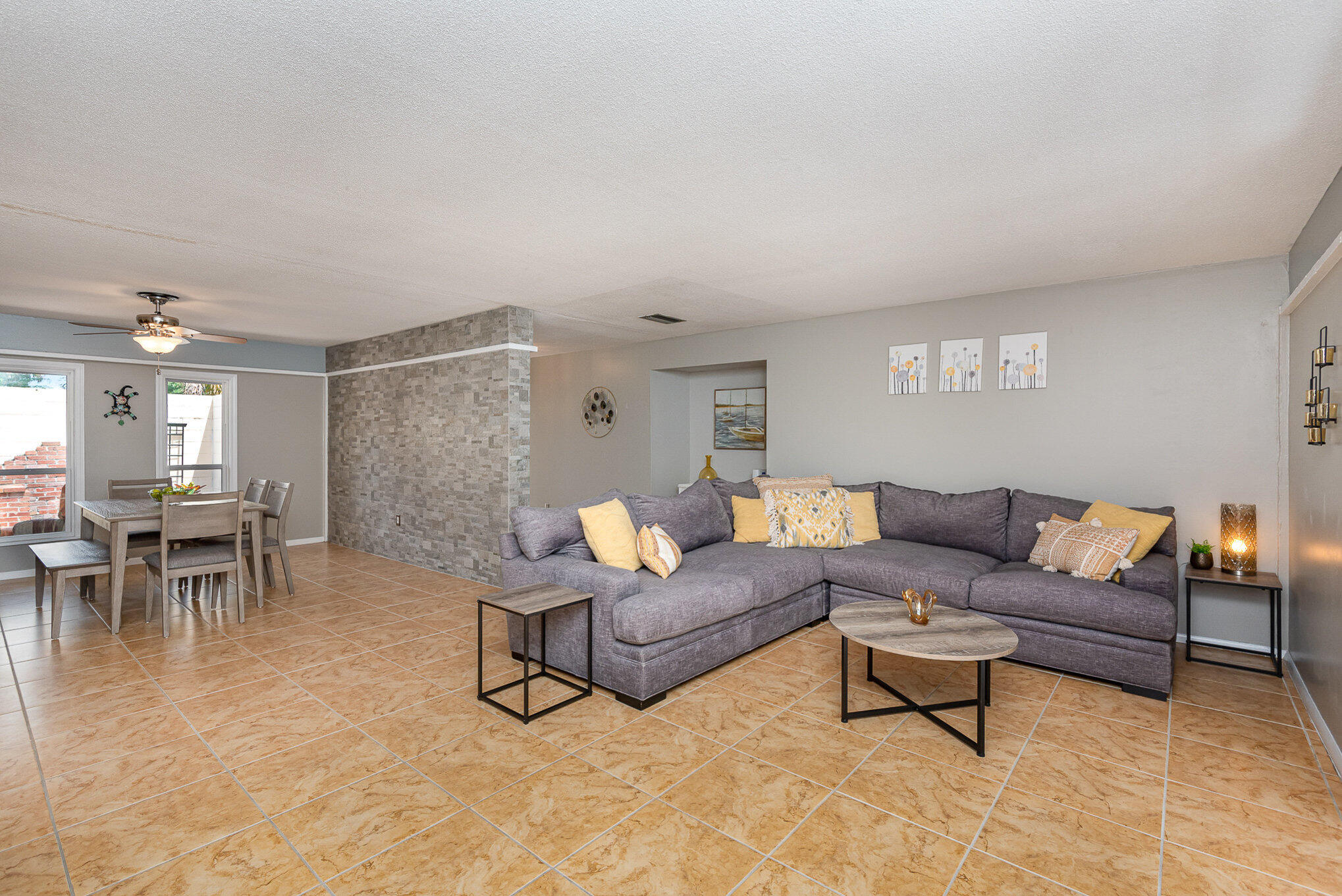 941 Levitt Parkway Rockledge, FL 32955 - Photo 3 of 33 a living room with furniture and a table