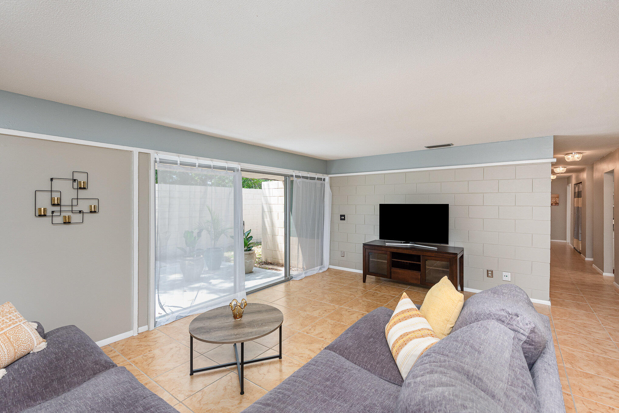 941 Levitt Parkway Rockledge, FL 32955 - Photo 8 of 33 a living room with furniture and a flat screen tv