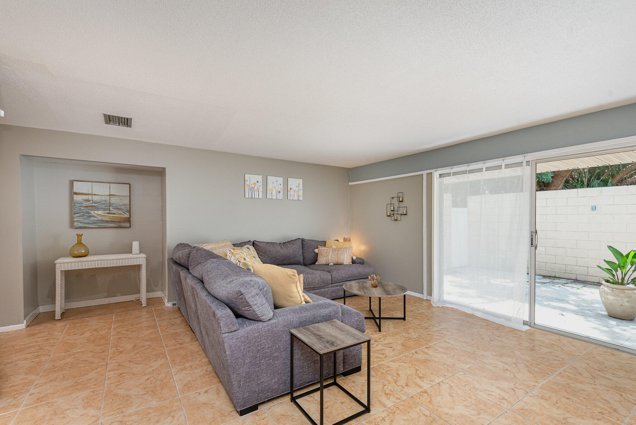 941 Levitt Parkway Rockledge, FL 32955 - Photo 9 of 33 a living room with furniture and a window