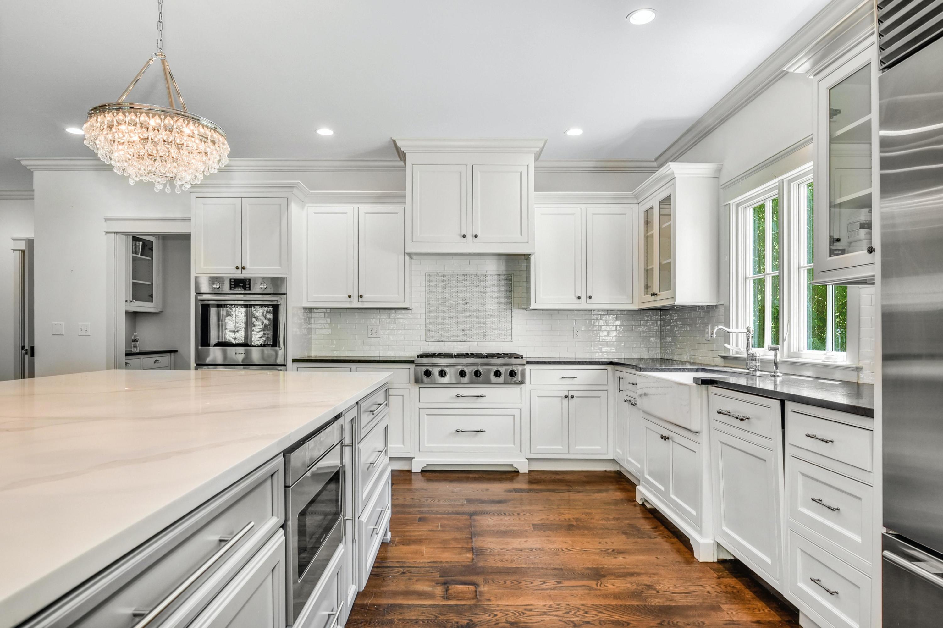 2271 Boston Post Road Darien, CT 06820 - Photo 13 of 40 a large kitchen with stainless steel appliances granite countertop a stove and cabinets