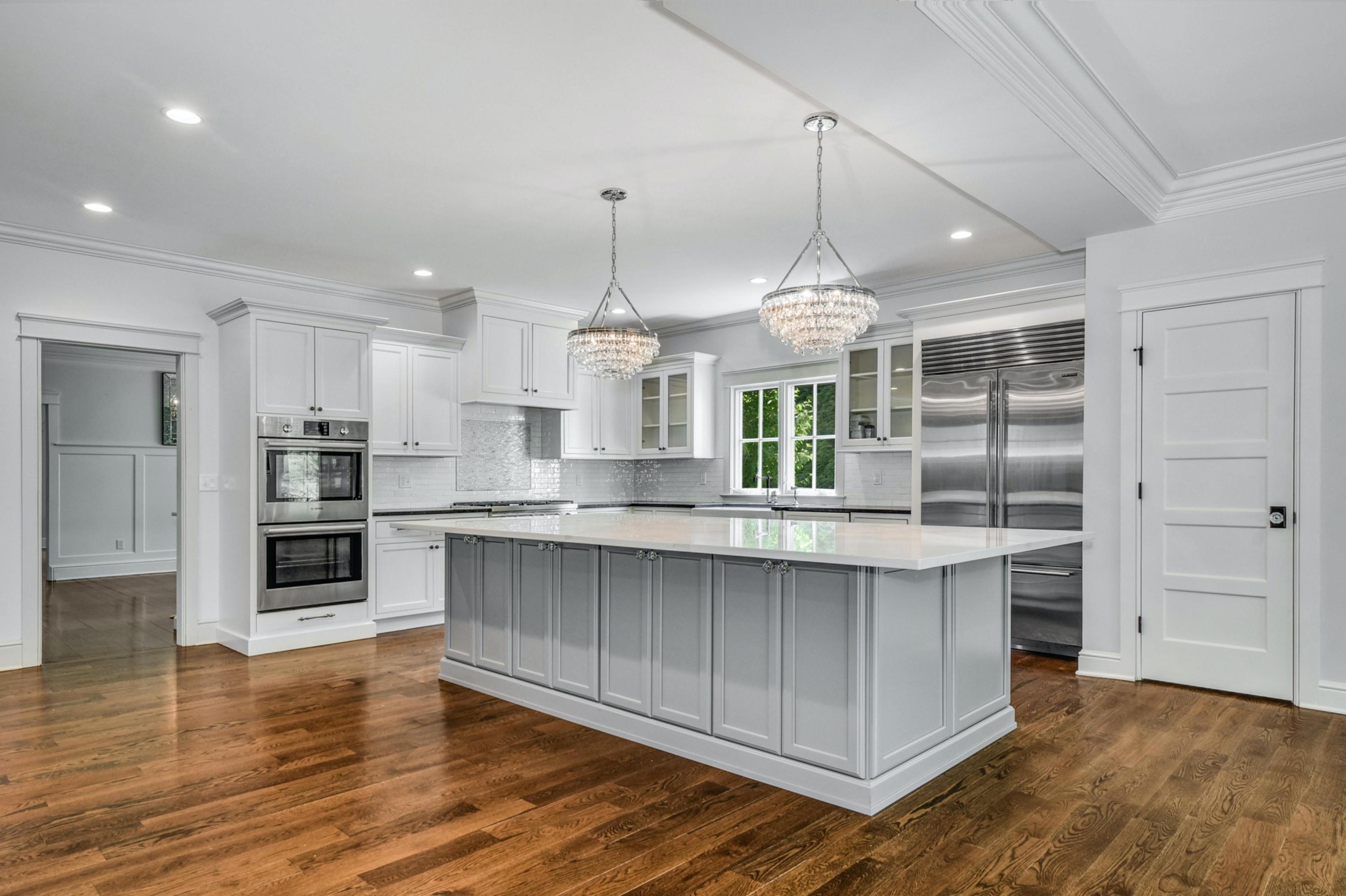 2271 Boston Post Road Darien, CT 06820 - Photo 14 of 40 a large kitchen with granite countertop a large counter top a sink stainless steel appliances and cabinets