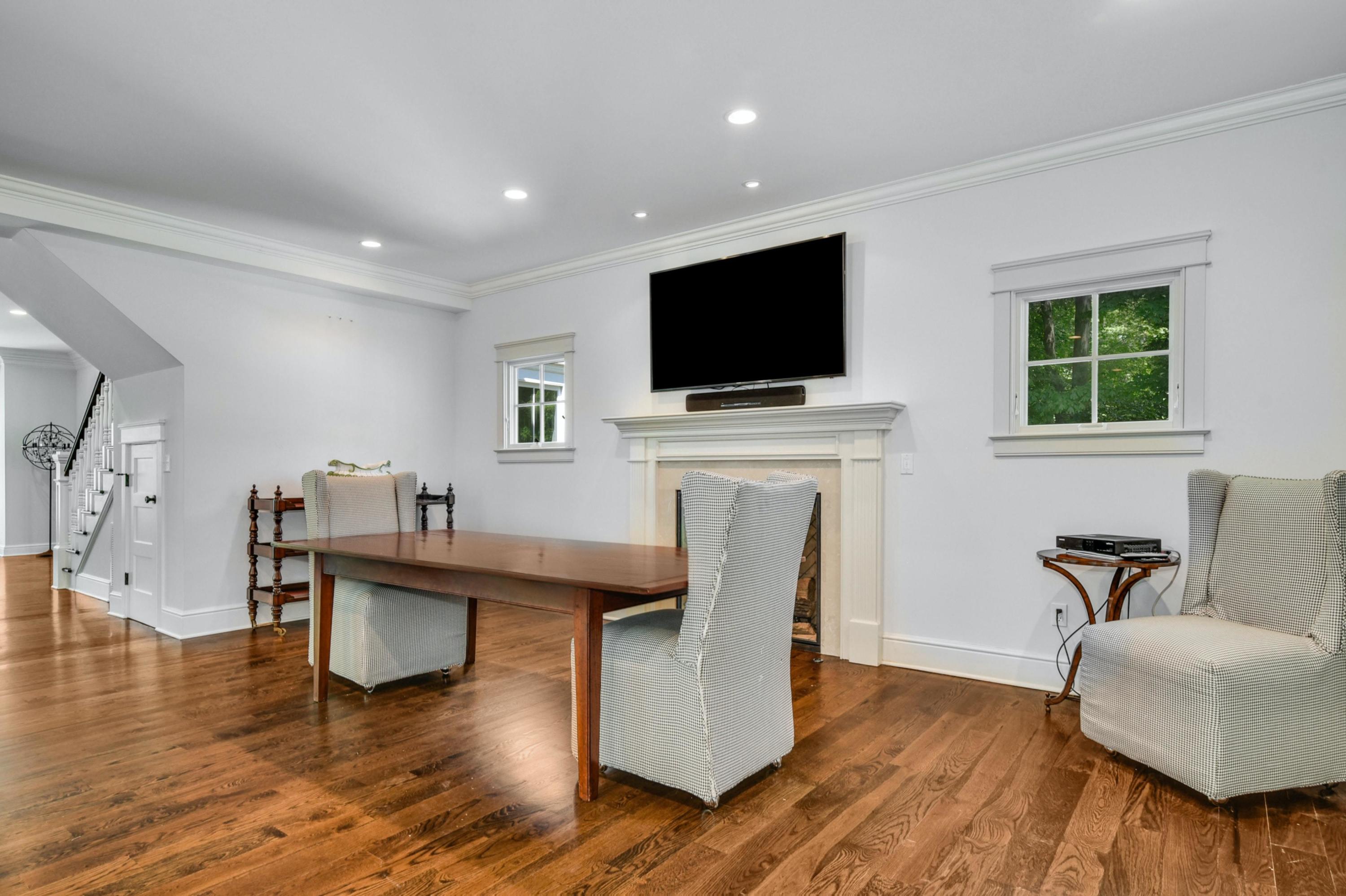 2271 Boston Post Road Darien, CT 06820 - Photo 15 of 40 a living room with furniture and a flat screen tv
