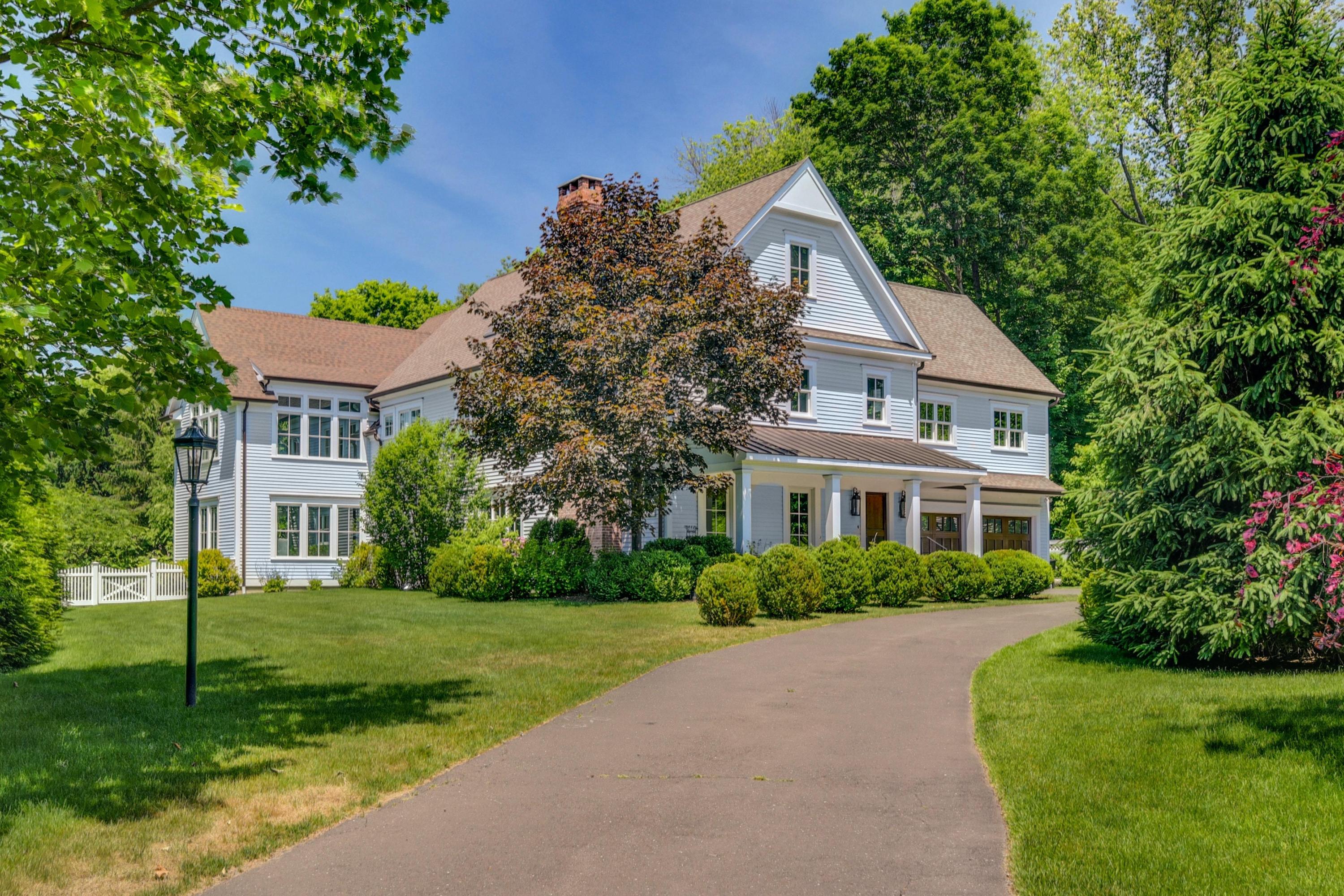 2271 Boston Post Road Darien, CT 06820 - Photo 2 of 40 a front view of house with yard and green space