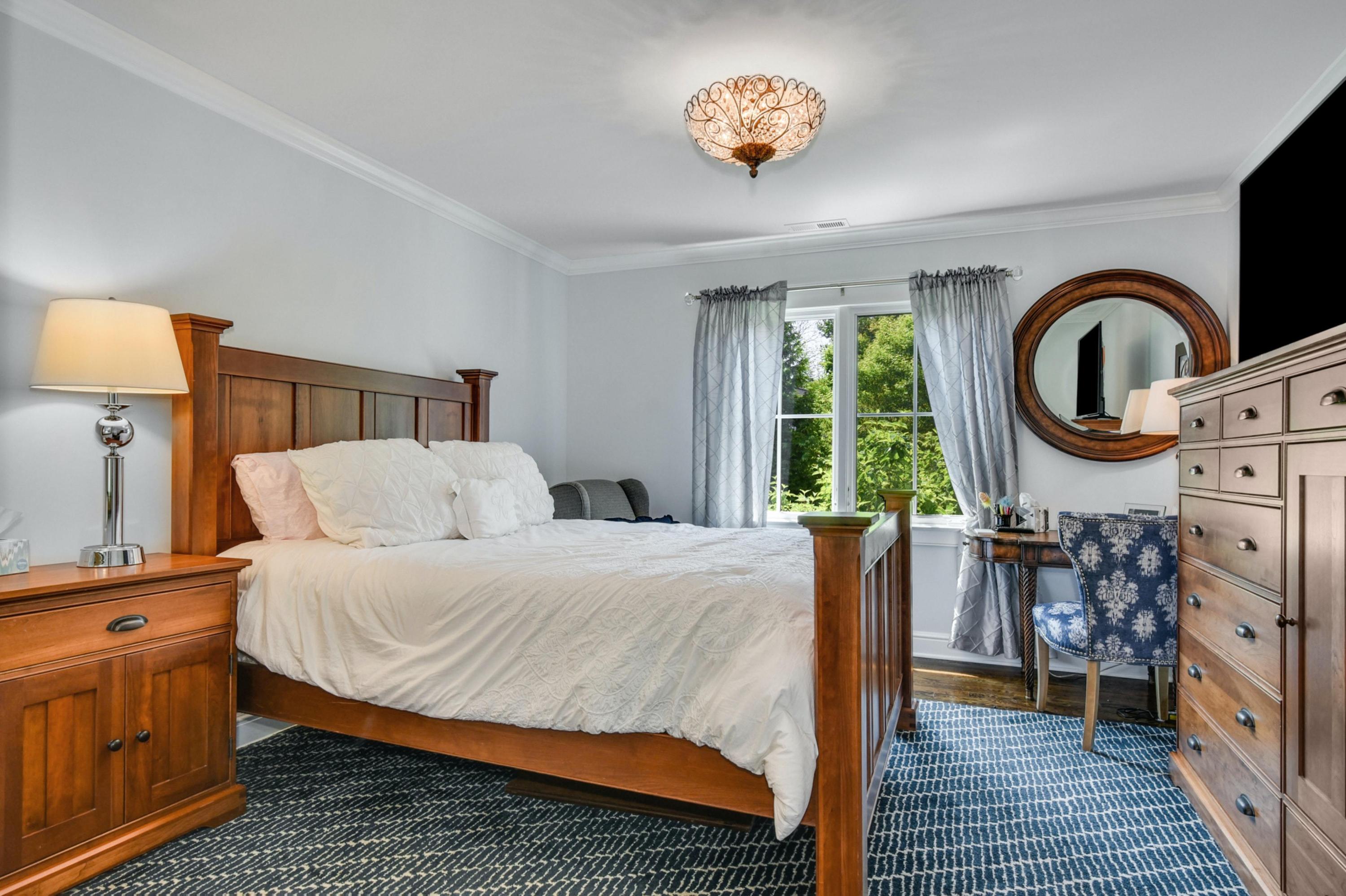 2271 Boston Post Road Darien, CT 06820 - Photo 22 of 40 a bedroom with bed and a large window