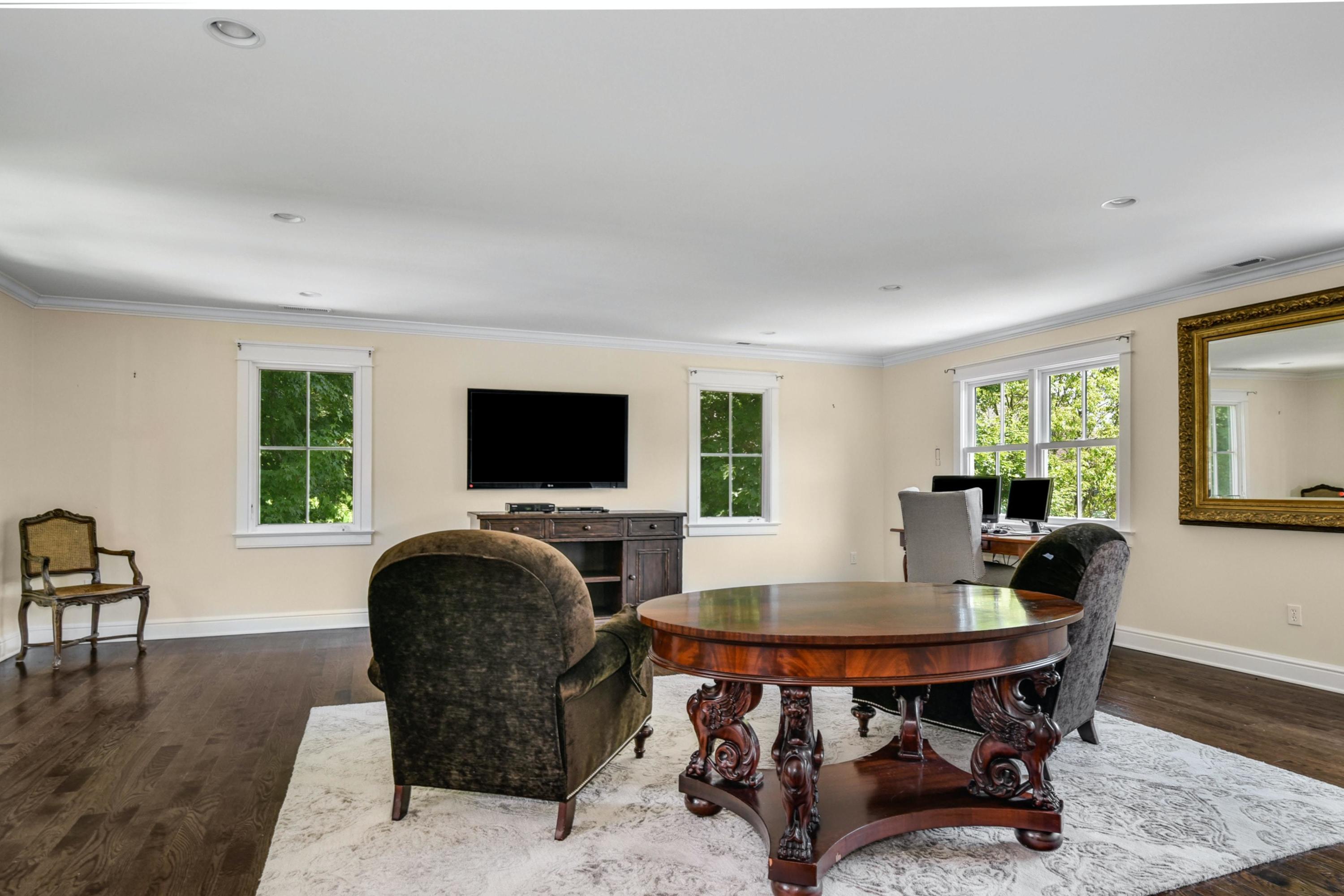 2271 Boston Post Road Darien, CT 06820 - Photo 23 of 40 a living room with furniture and a flat screen tv