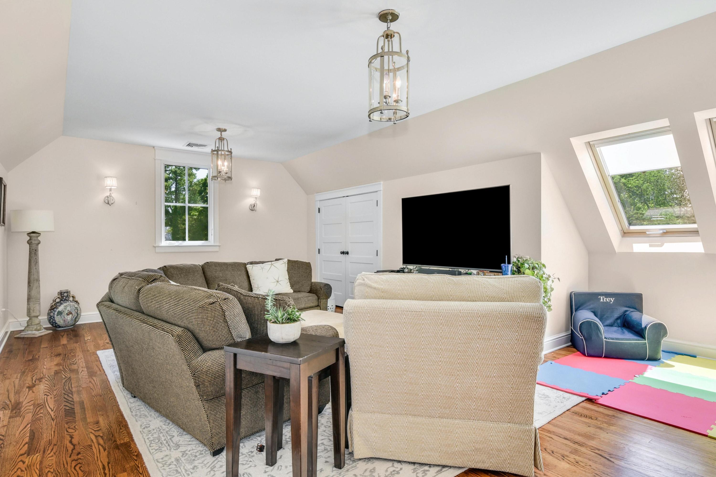 2271 Boston Post Road Darien, CT 06820 - Photo 25 of 40 a living room with furniture and a flat screen tv