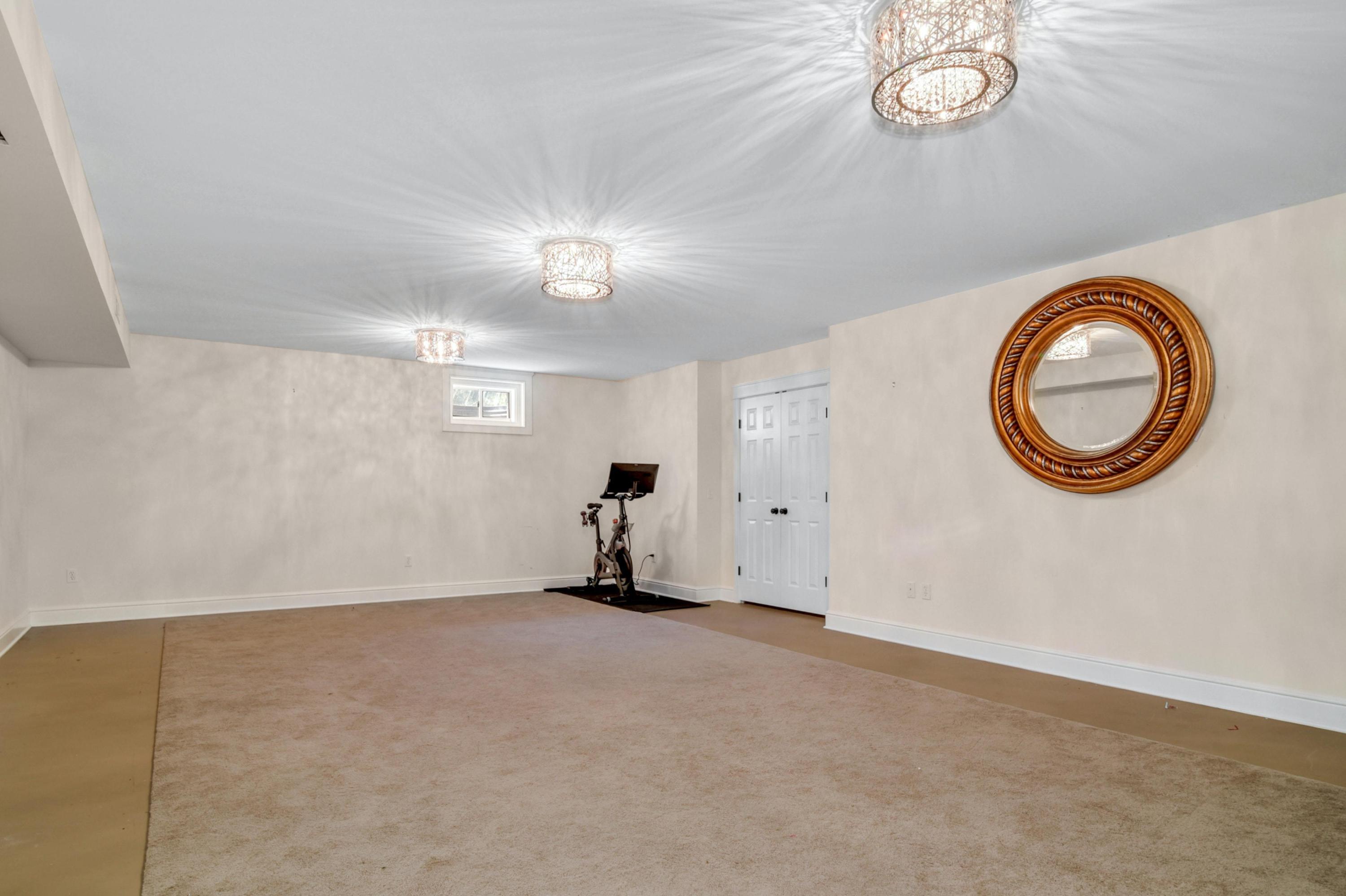 2271 Boston Post Road Darien, CT 06820 - Photo 26 of 40 an empty room with a fan & a large window