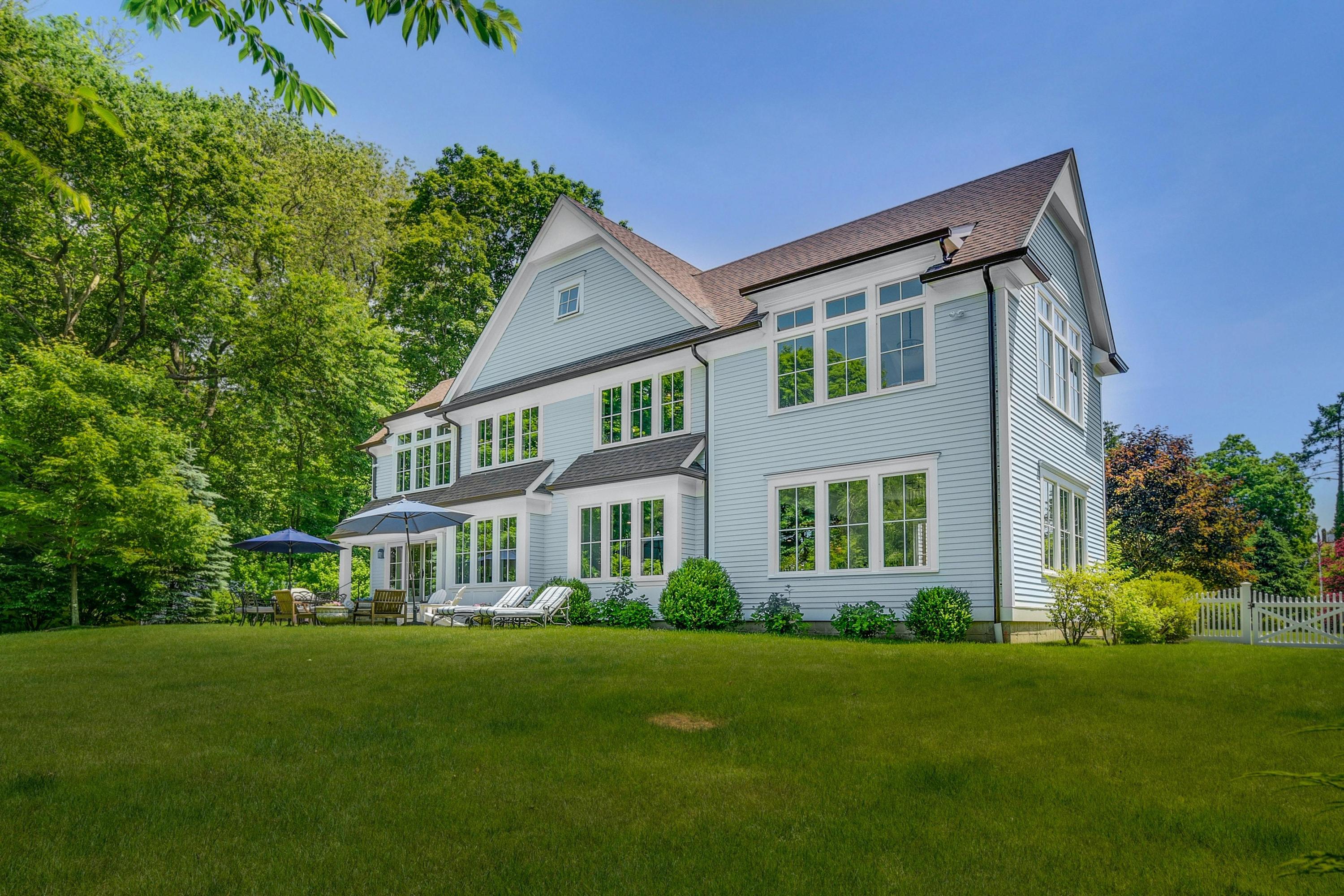 2271 Boston Post Road Darien, CT 06820 - Photo 28 of 40 a front view of a house with a garden