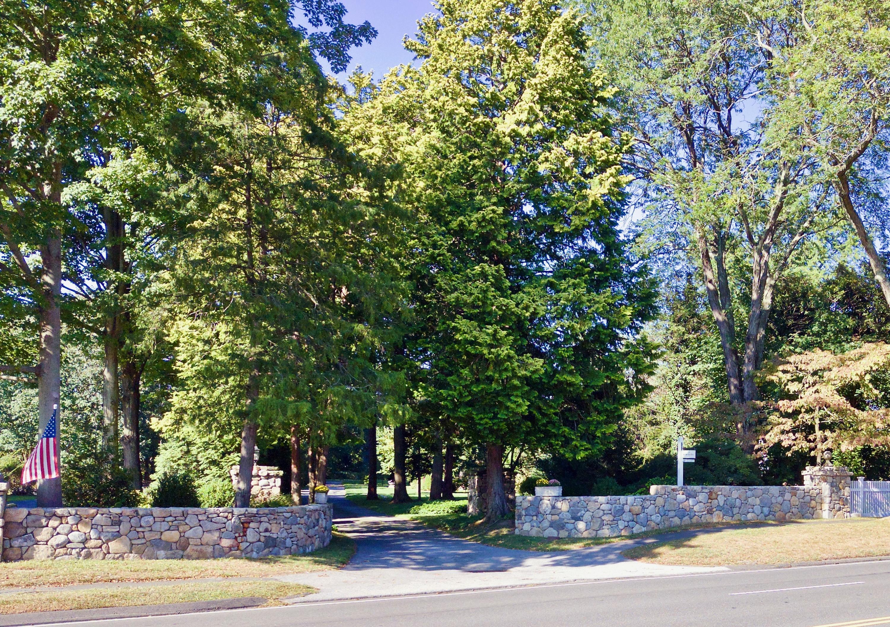 2271 Boston Post Road Darien, CT 06820 - Photo 34 of 40 a view of a fountain in front of a house