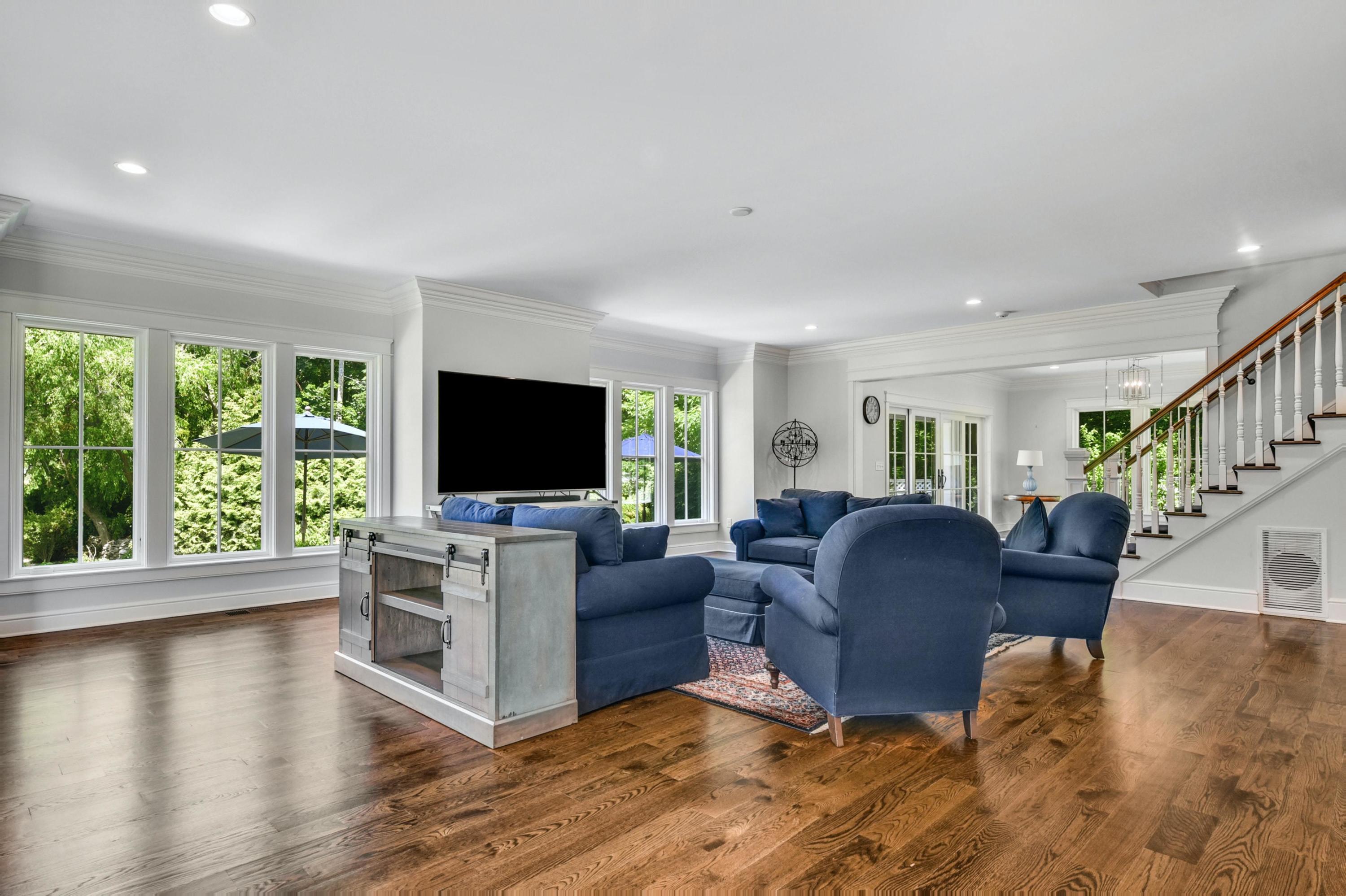 2271 Boston Post Road Darien, CT 06820 - Photo 4 of 40 a living room with furniture flat screen tv and a large window