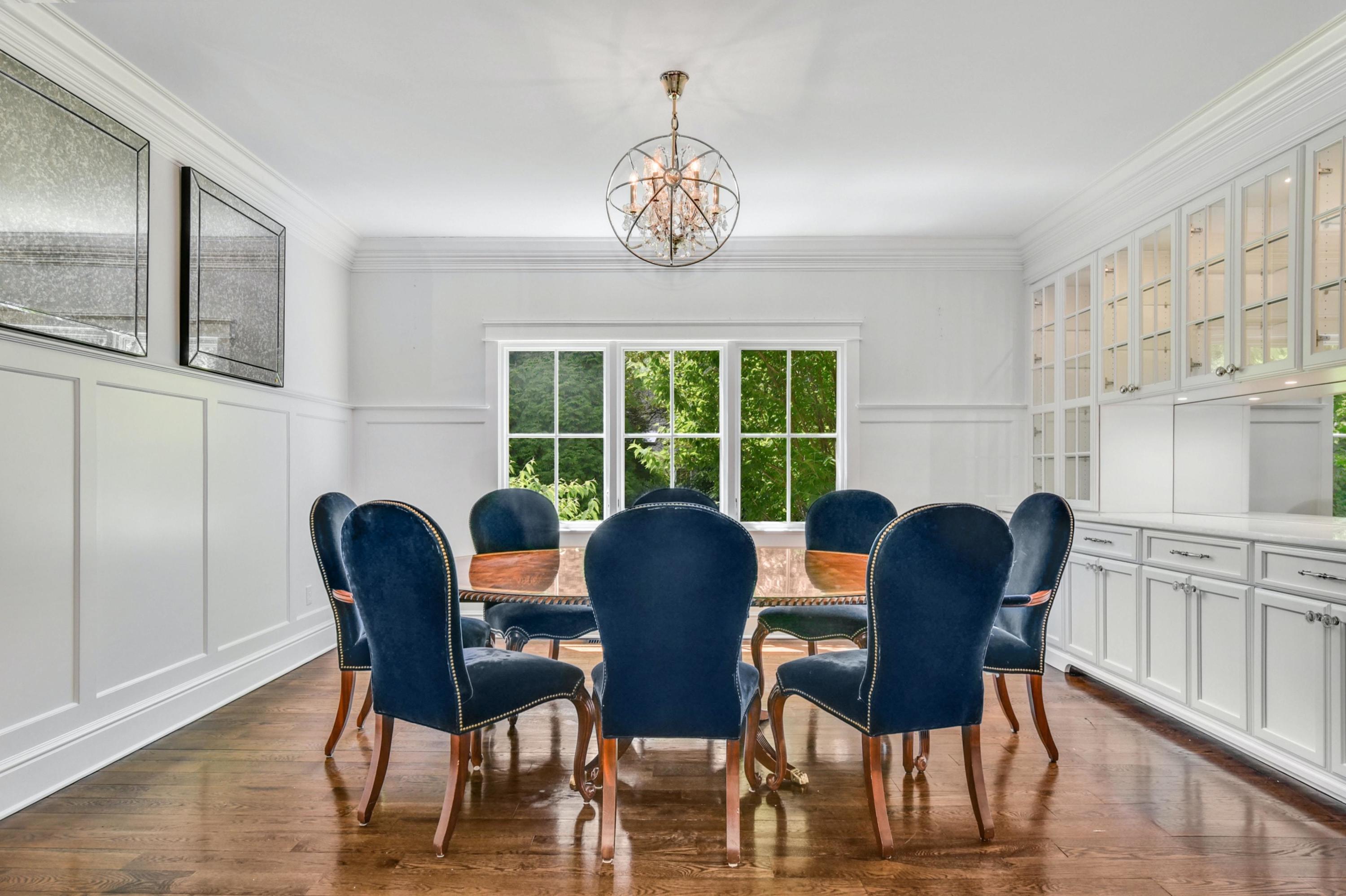 2271 Boston Post Road Darien, CT 06820 - Photo 9 of 40 a dining room with furniture a chandelier and wooden floor
