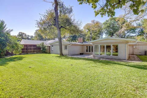 a front view of house with yard and seating area