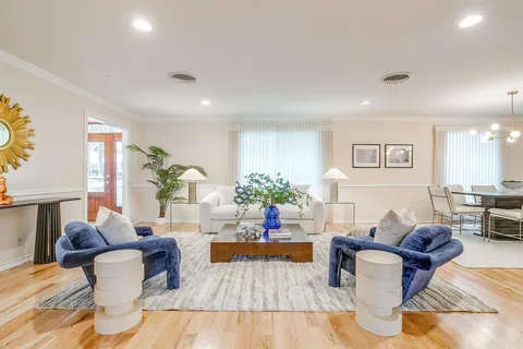 a living room with furniture or couch and a table