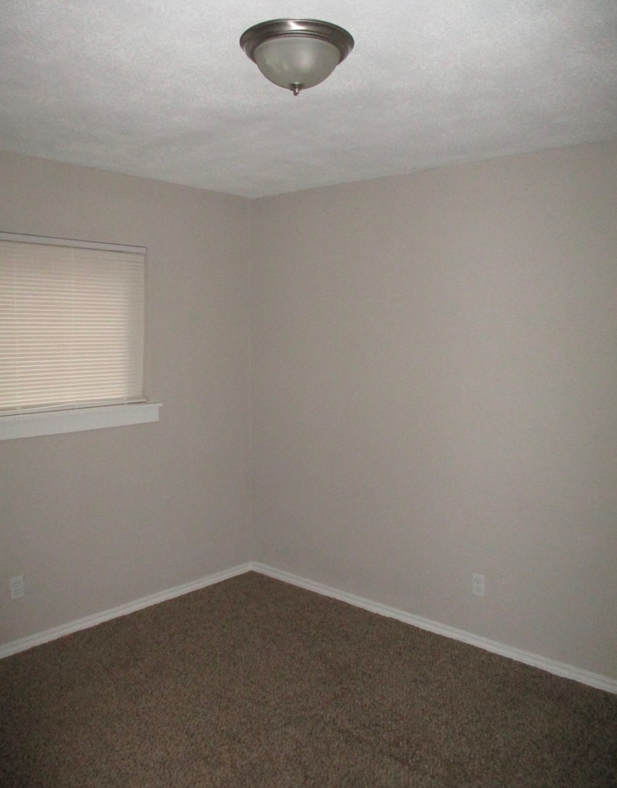 2106 Woodway Drive Woodbranch, TX 77357 - Photo 11 of 17 an empty room with a workbench
