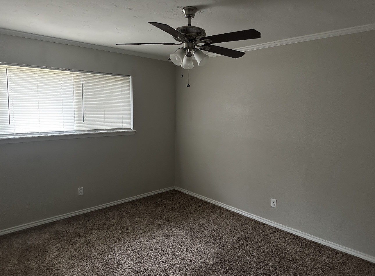 2106 Woodway Drive Woodbranch, TX 77357 - Photo 13 of 17 an empty room with a window and a fan