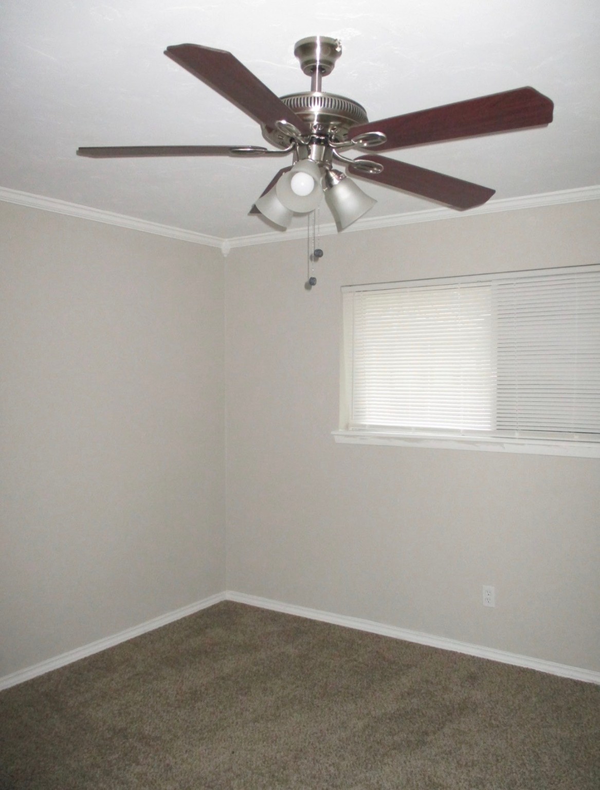 2106 Woodway Drive Woodbranch, TX 77357 - Photo 14 of 17 an empty room with a window and a fan