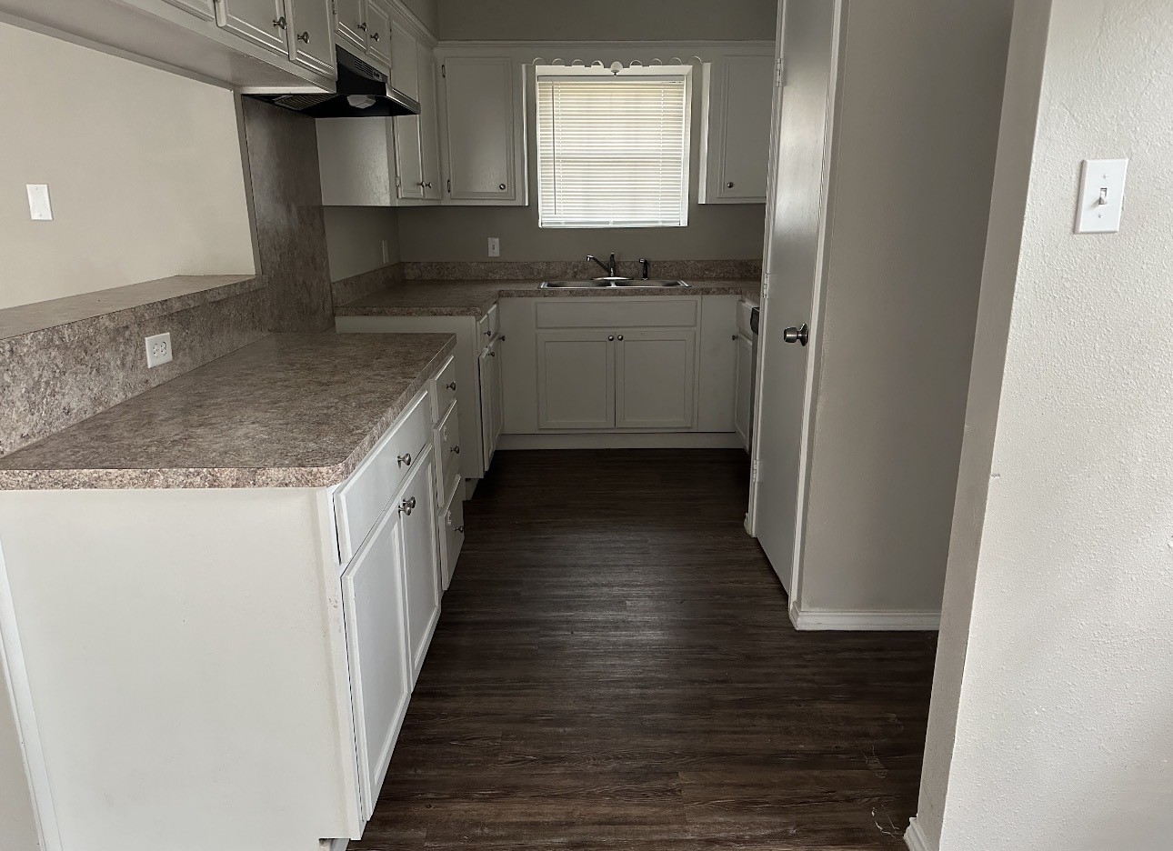 2106 Woodway Drive Woodbranch, TX 77357 - Photo 6 of 17 a kitchen with stainless steel appliances granite countertop a sink and a stove top oven