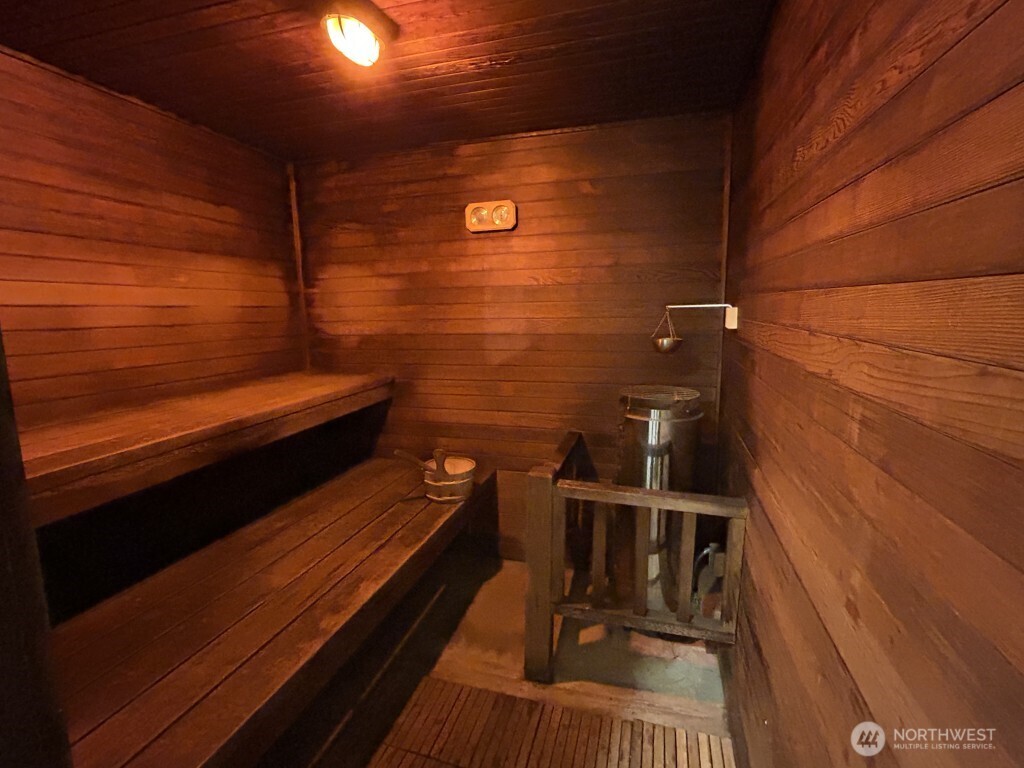 4561 Lake Washington Boulevard Northeast, Unit 303 Kirkland, WA 98033 - Photo 14 of 16 a balcony with a bench