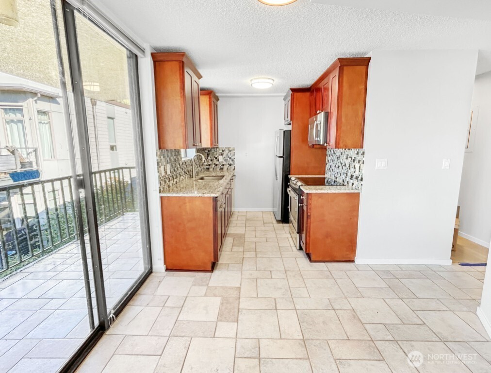 4561 Lake Washington Boulevard Northeast, Unit 303 Kirkland, WA 98033 - Photo 6 of 16 a view of a storage with an empty room and wooden floor