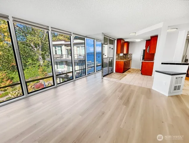 a room with wooden floor and furniture